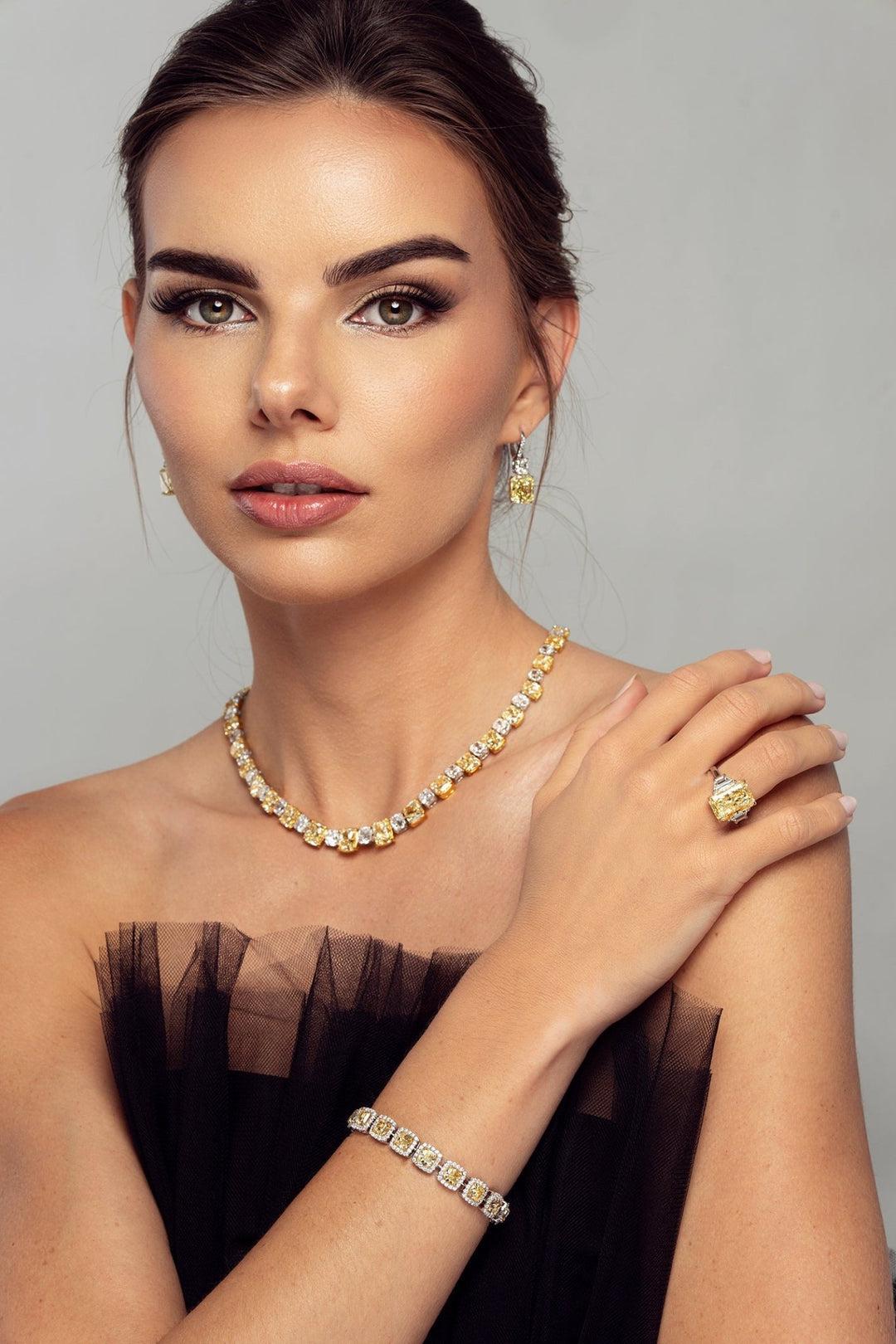 Crafted for the most discerning collectors, the LEGACY 75 Carat Fancy Yellow to Light Yellow Cushion Diamond Necklace is a masterpiece of warmth, brilliance, and balance — brought to life through natural diamonds of impeccable pedigree.

Composed