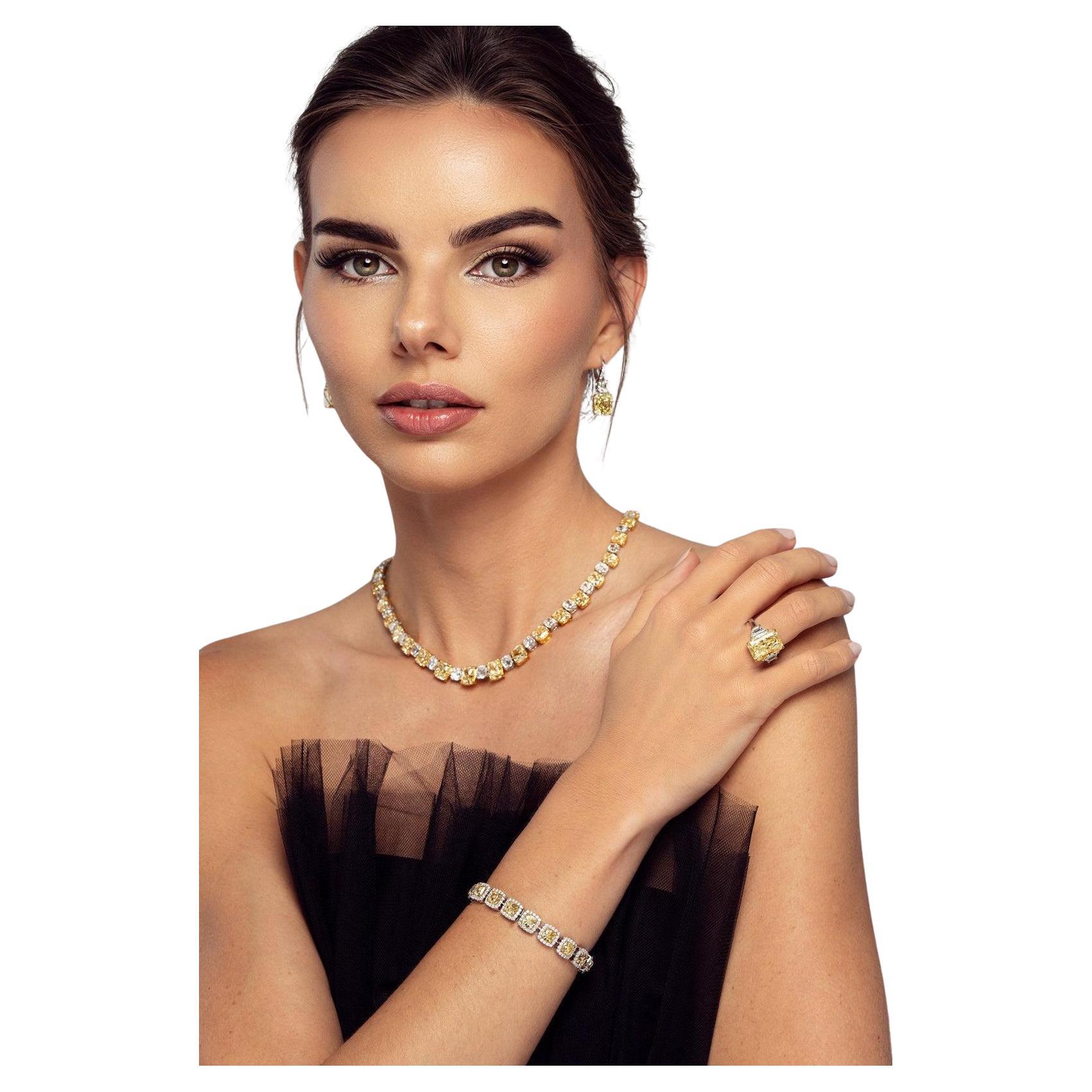 A symphony of light in its warmest expression — the LEGACY 65 Carat U–Z Cushion Diamond Necklace is a celebration of rare color, precision, and presence.

Crafted entirely from natural cushion-cut diamonds ranging in color from U to Z, this necklace