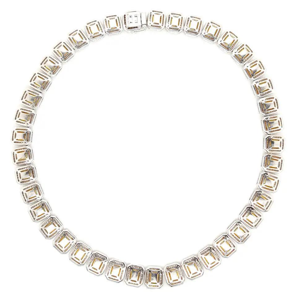 A river of golden brilliance, carved in fire and framed in legacy — this 80 Carat Fancy Yellow Cushion Cut Diamond Necklace, featuring individually 1.5 carat GIA-certified natural diamonds, is a triumph of harmony, rarity, and heritage. Created for