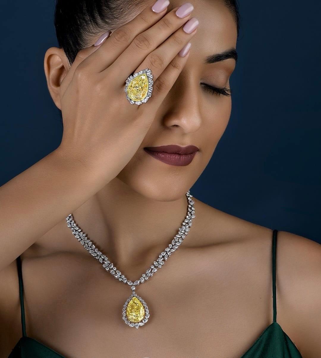 There are diamonds that shine — and then, there are diamonds that define.
This 15 Carat Fancy Yellow Pear-Shaped Diamond Necklace is not merely a piece of jewelry — it is a singular moment captured in color, proportion, and grace.

At its heart lies