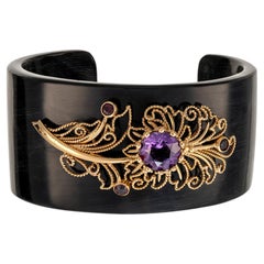 Bracelet with gold application, amethyst, and quartz on horn material