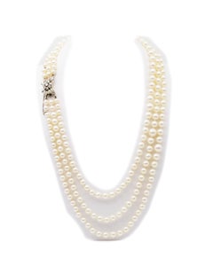 Three strands cultured pearls necklace, gold and diamond clasp, 1970's French