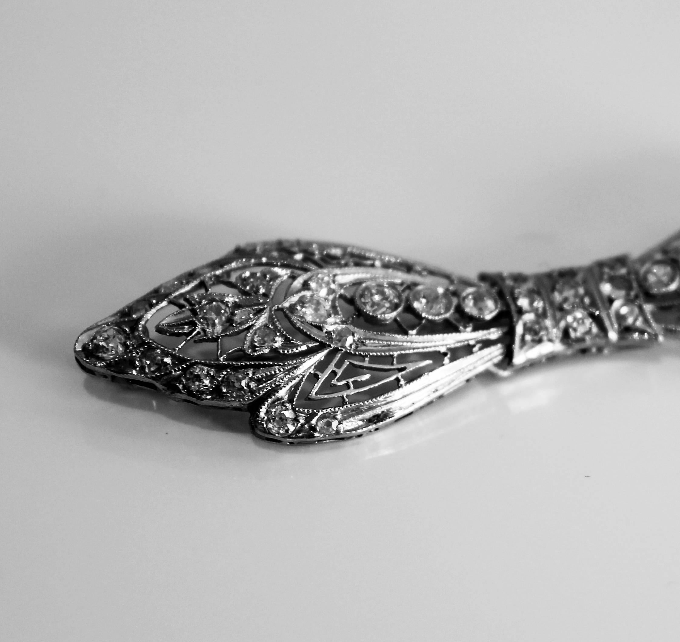Women's Art Deco Diamond Platinum Bow Brooch For Sale