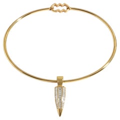 LÖF 18k Yellow Gold Torque Necklace with a baguette diamond drop pendant