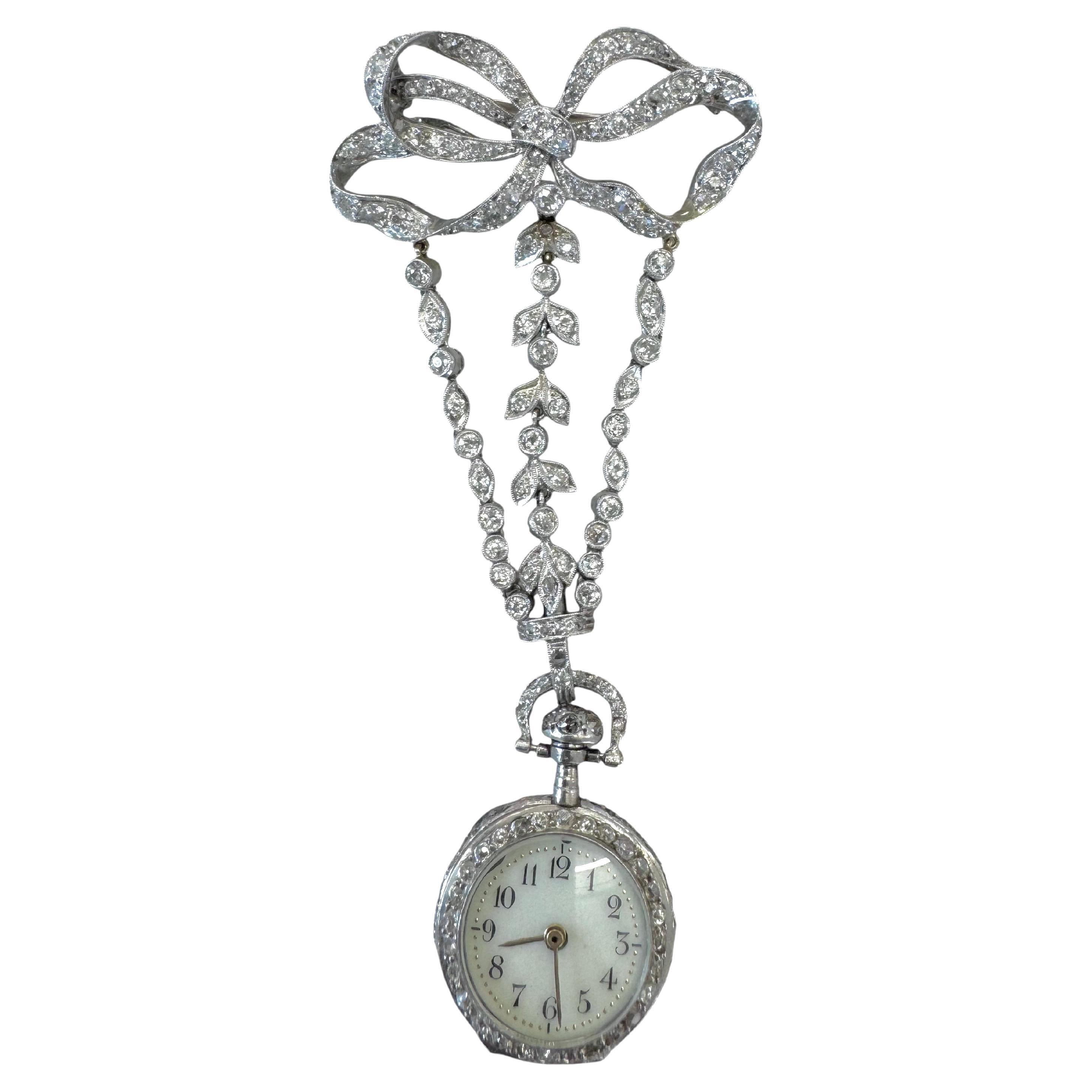 Diamant-Anhängeruhr aus Platin und Gold mit Saphir-Akzenten