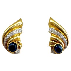 Boucles d'oreilles en or jaune 18K avec saphir cabochon et diamant