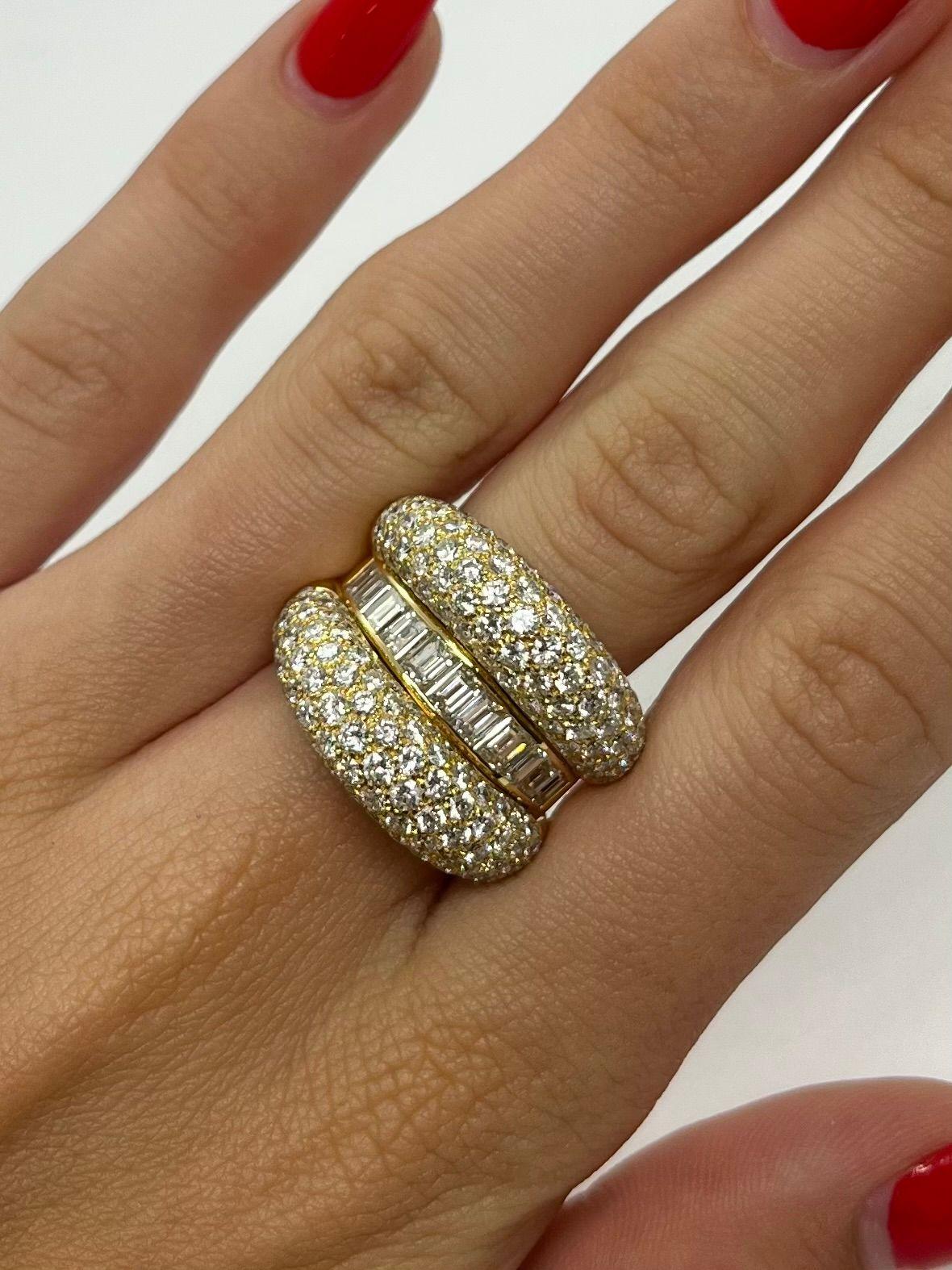 Questo splendido anello in oro giallo 18 carati (750/1000) è una vera e propria dichiarazione di lusso e brillantezza. È incastonato con un impressionante totale di circa 5 carati di diamanti naturali, che combinano tagli a baguette e a brillante