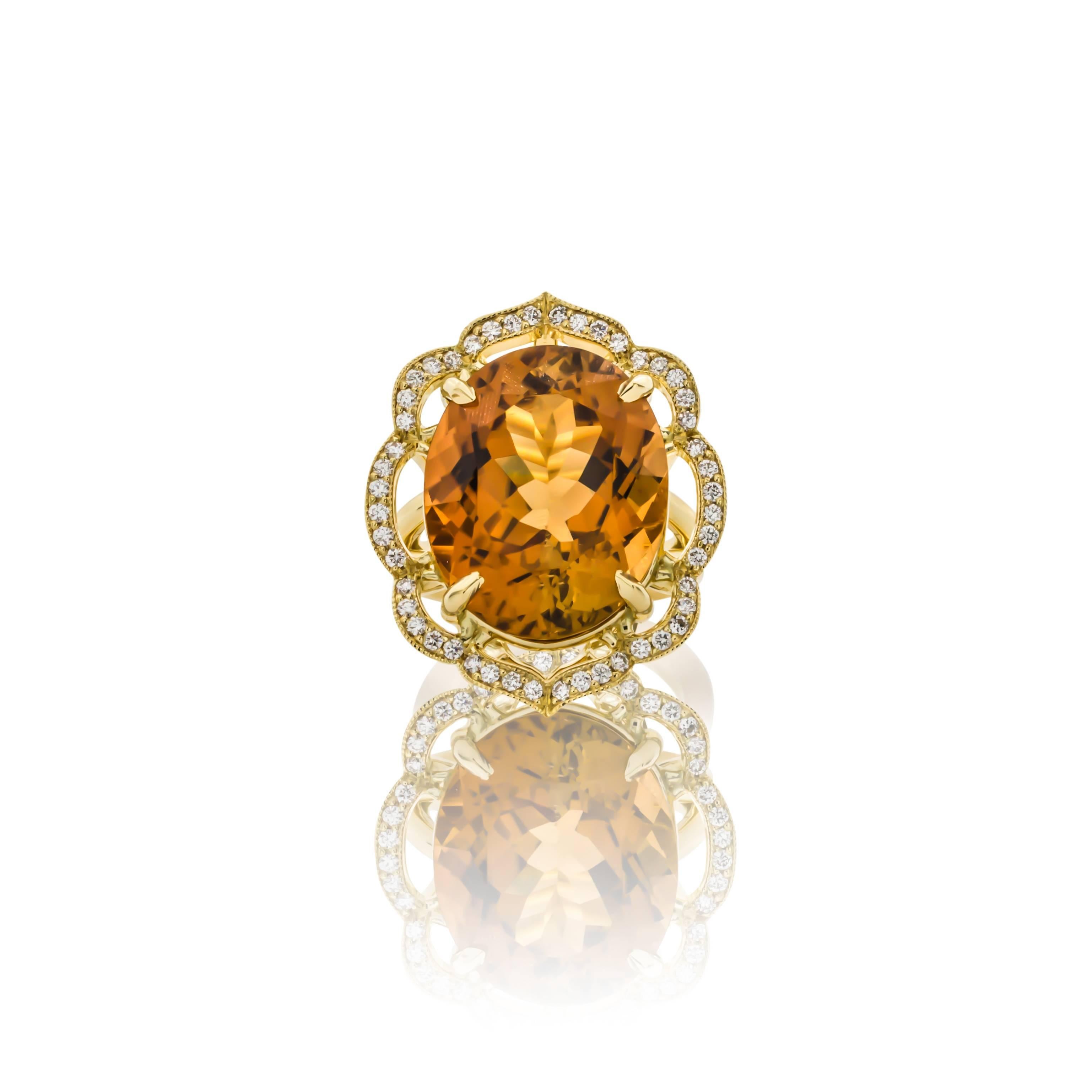 Brand New: One of a kind 18K yellow gold orange tourmaline & diamond ring.  Prong set with one oval orange tourmaline weighing 23.27 carats of fine color and clarity, surrounded by a scalloped design accented with forty-eight round brilliant cut
