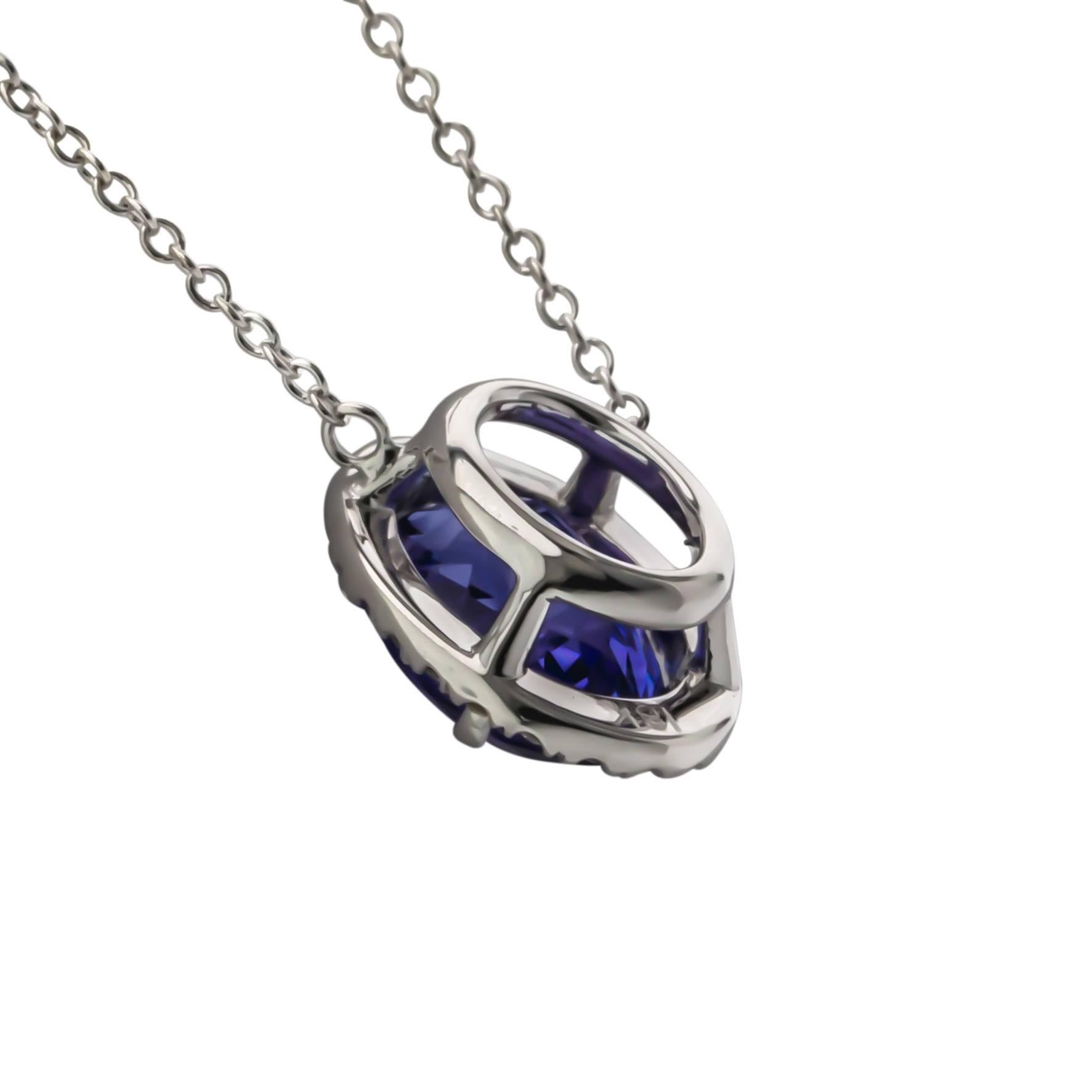 One of a Kind 18K white gold tanzanite and diamond 18" necklace.  Prong set with one oval tanzanite weighing 3.46 carats of fine color and clarity, surrounded by twenty-four round brilliant cut diamonds weighing .18 carats total weight, G color