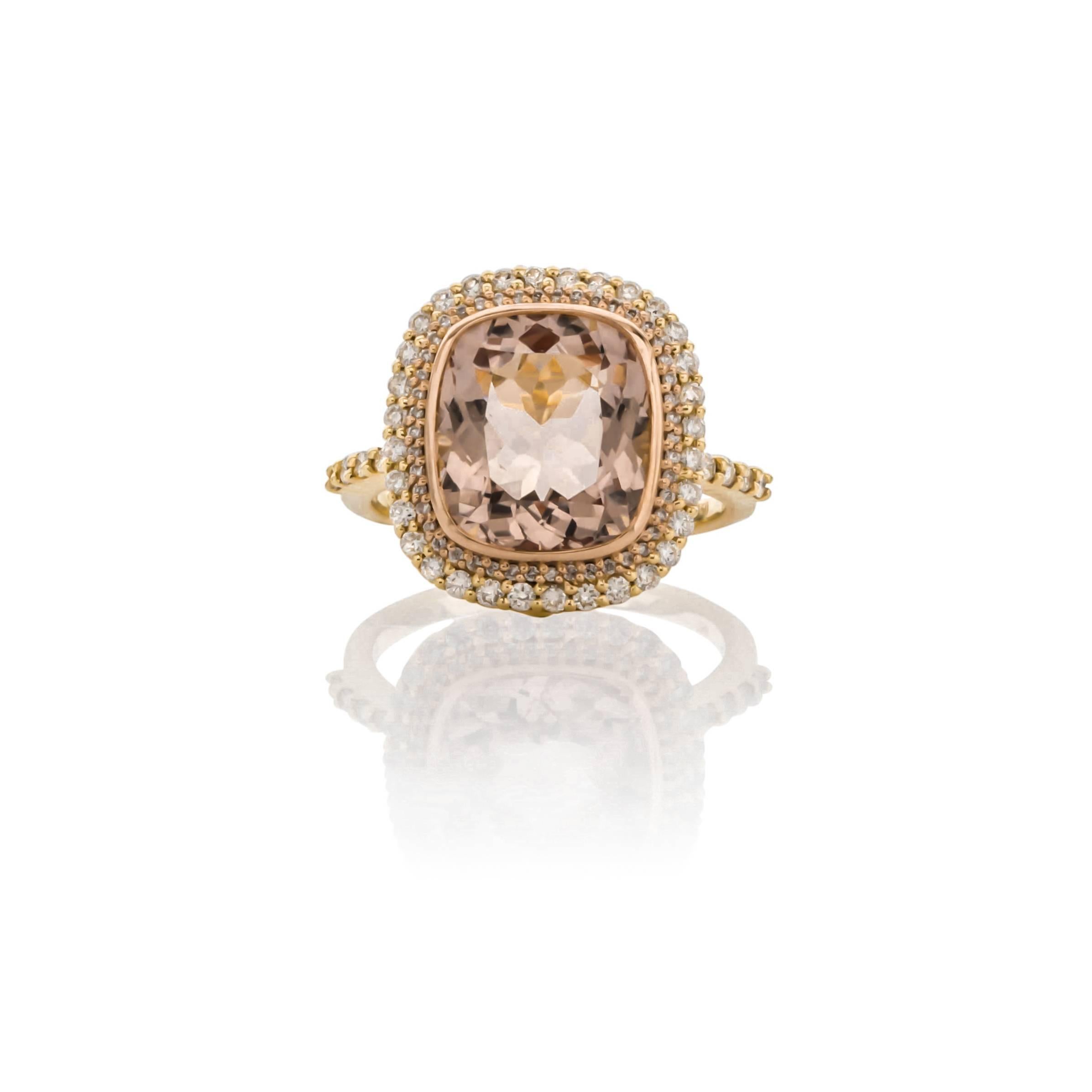 18K yellow and rose gold morganite and diamond ring. Set with one cushion cut morganite weighing 4.53 carats of fine color and clarity, surrounded by ninety round brilliant cut diamonds weighing .55 carats total weight, G color and VS clarity.