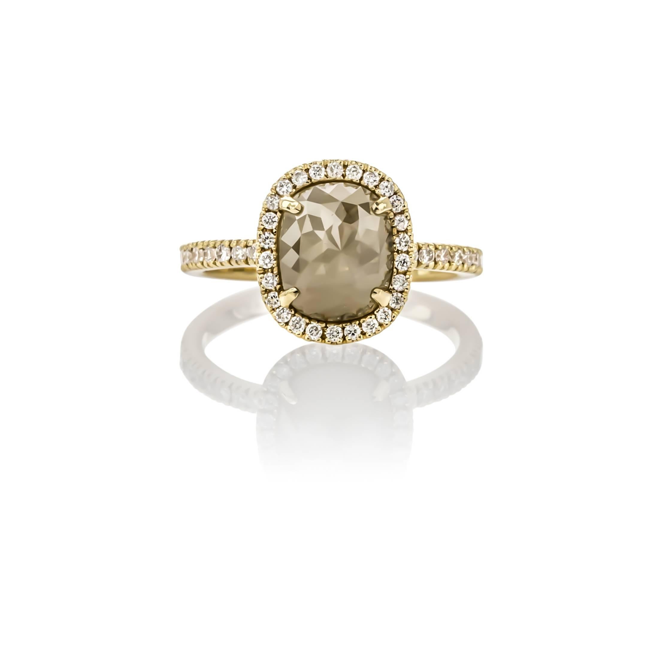 18K yellow gold opaque diamond halo ring, by Sethi Couture. Set with one faceted oval shape opaque diamond weighing 2.37 carats, surrounded by round diamonds weighing .34 carats total weight.

Finger size 6.25, can be re-sized.