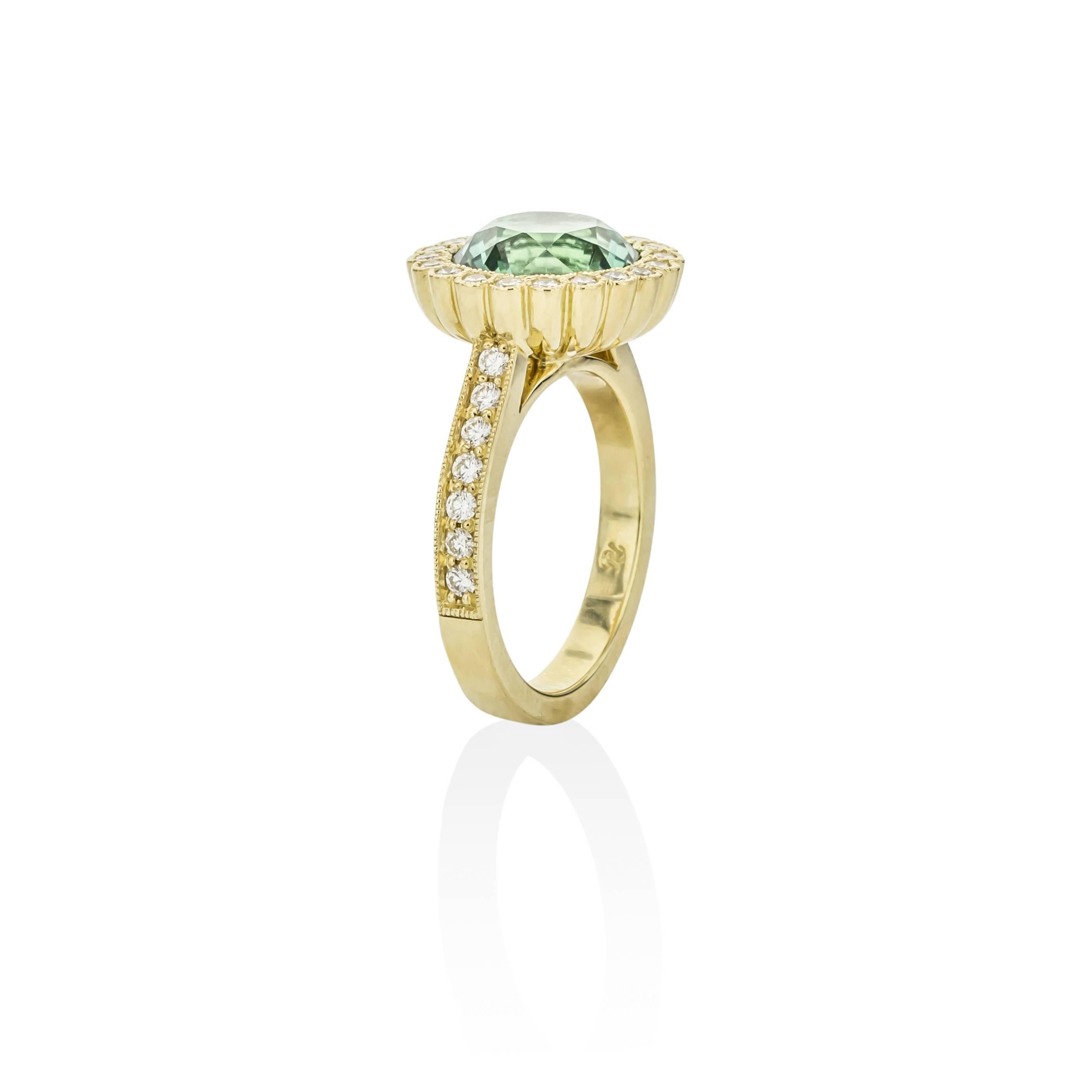 This stunning 18K yellow gold ring is truly one of a kind. 

Features one 4.59 carat round tourmaline stone and 34 diamonds equaling .66 carats. 

This beautiful ring is a size 7 and come in a ring presentation box.