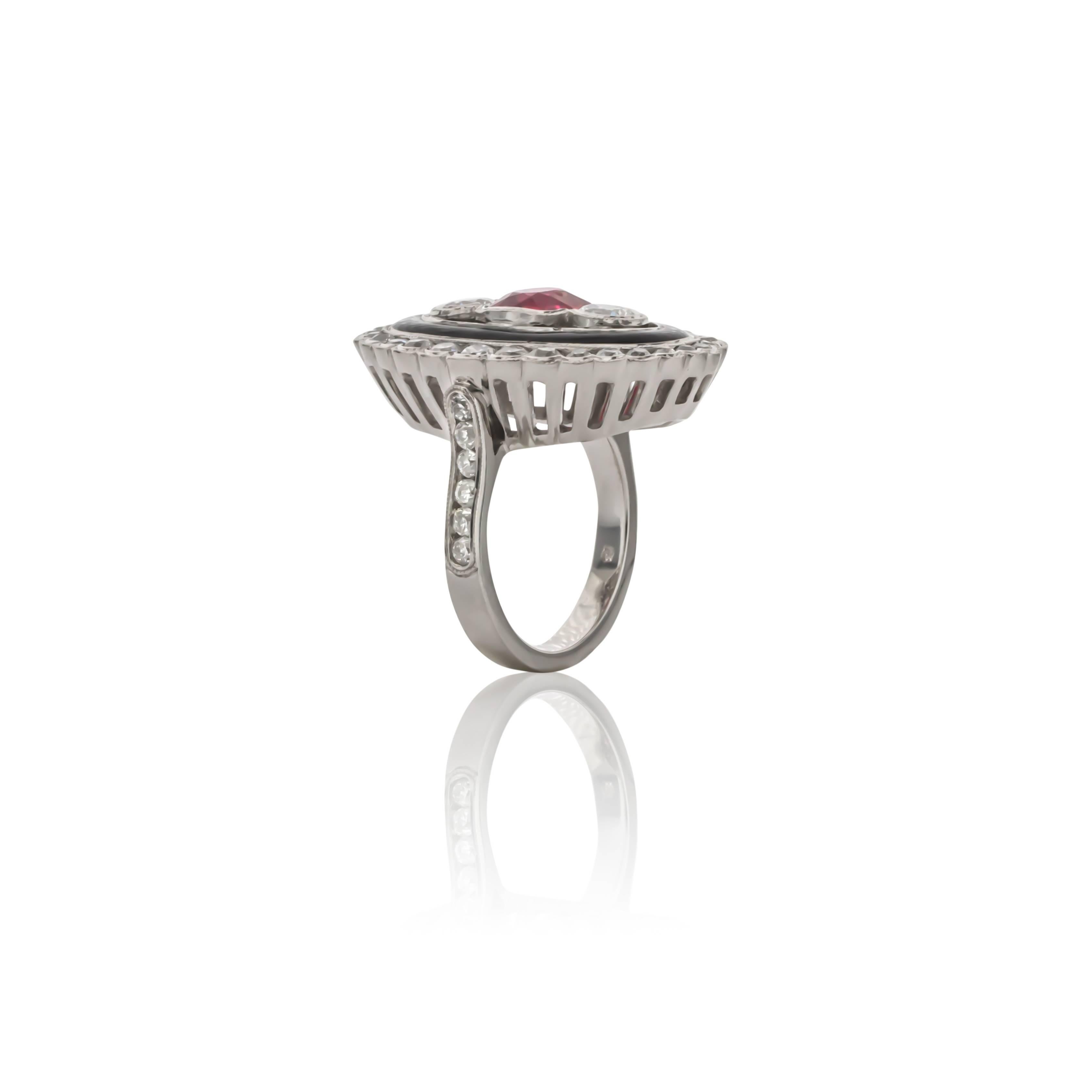 One of a kind platinum red spinel, diamond, and black enamel cocktail ring. Bezel set with one cushion cut red spinel weighing 1.77 carats of fine color and round brilliant cut diamonds weighing 2.57 carats total weight, G color and VS clarity. 
