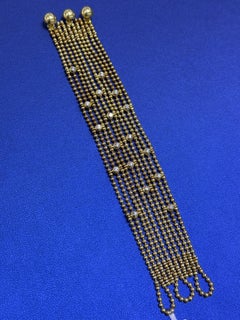 Bracelet « Draperie de Décolleté » de Cartier, en or jaune 18 carats, orné de perles et de maillons multiples, serti de diamants