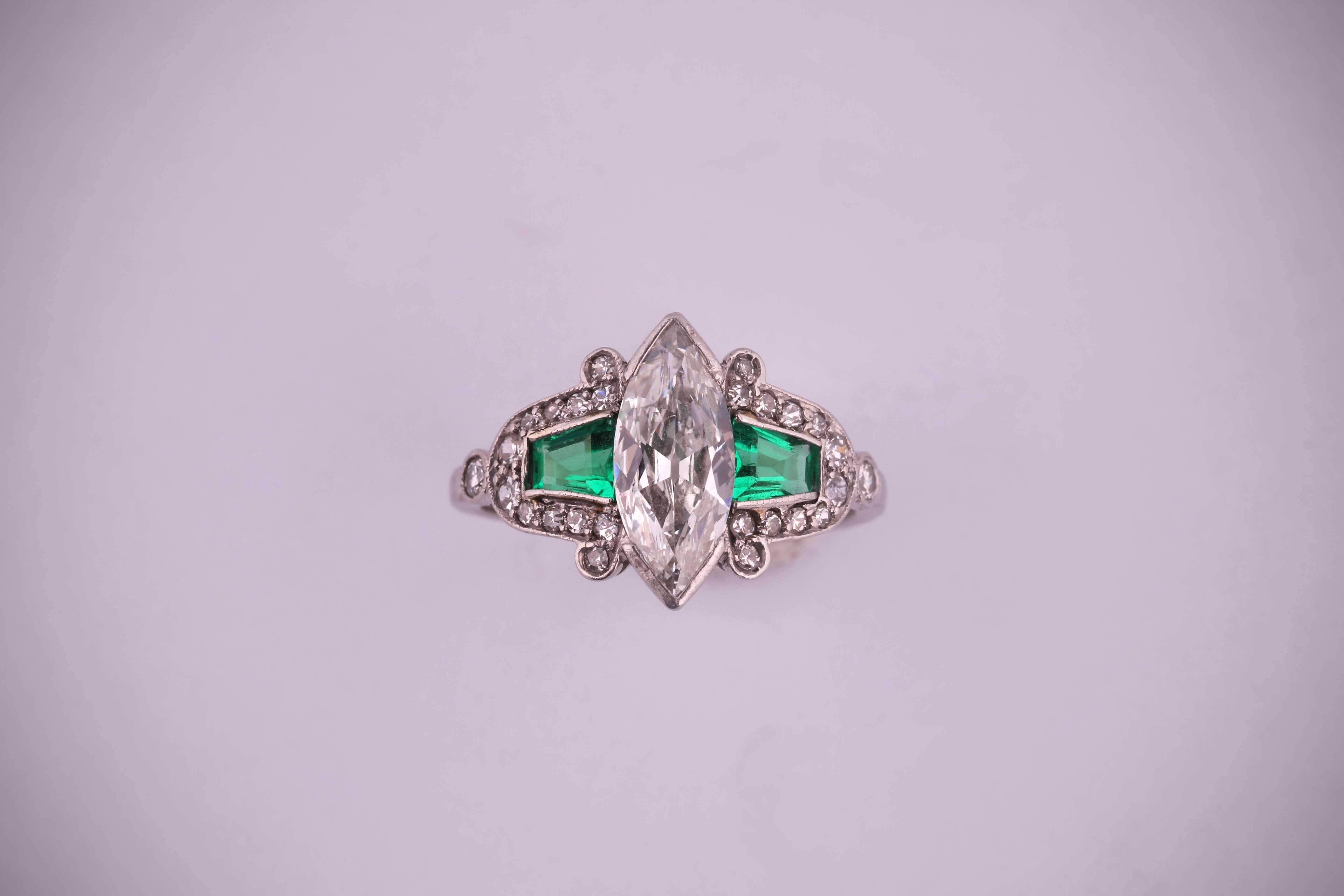 Platinum (tested) ring with a central marquise shape diamond, round 8/8 diamonds and 2 natural trapezoidal shape step cut emeralds. 1910-1920 circa
Marquise diamond: 12.30 x 5.16 x 2.34 mm, 0.80/0.85 ct
Size: 6.25 (USA), 52. (Europe)
It can be