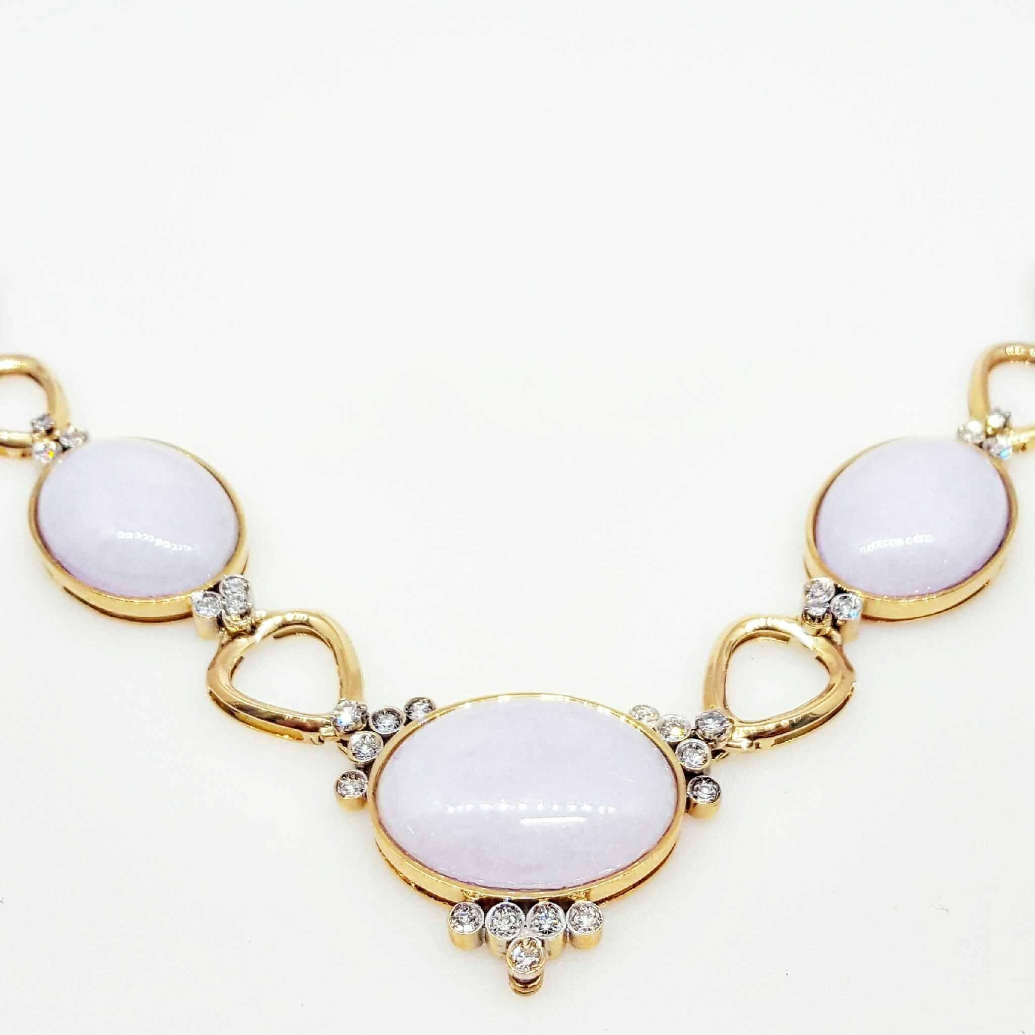 Beautiful necklace set with five, exquisite, oval shaped lavender jade stones. The necklace also is set with an approximate 3.00cttw of, stunning, bezel set, diamonds. The necklace is made of 18 karat yellow gold and is 23 inches long.