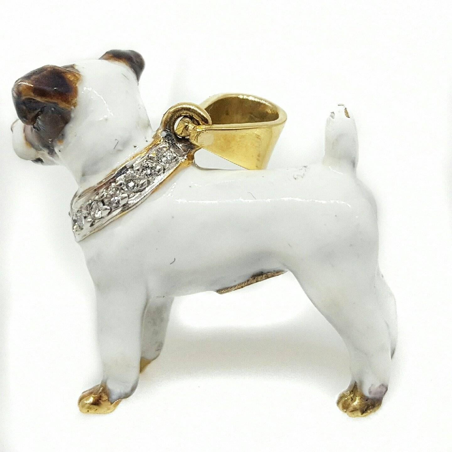 18 karat yellow gold Terrier pendant. The pendant is solid 18 karat yellow gold painted with enamel and set with round brilliant cut diamonds. The pendant measures 1