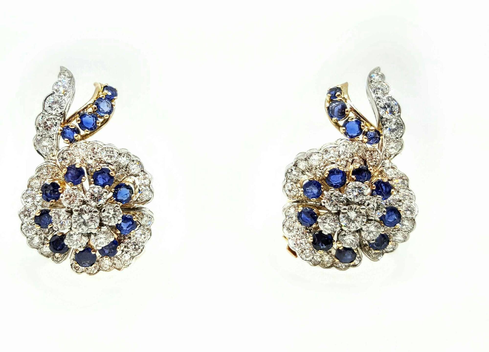 Stunning Diamond and Sapphire Earrings. Approximately 5.00cttw of diamonds and 4.00cttw of Sapphires set in 18 karat white and yellow gold. The earrings have clip on style backs. The diamonds are G-H color and VS1-VS2 clarity