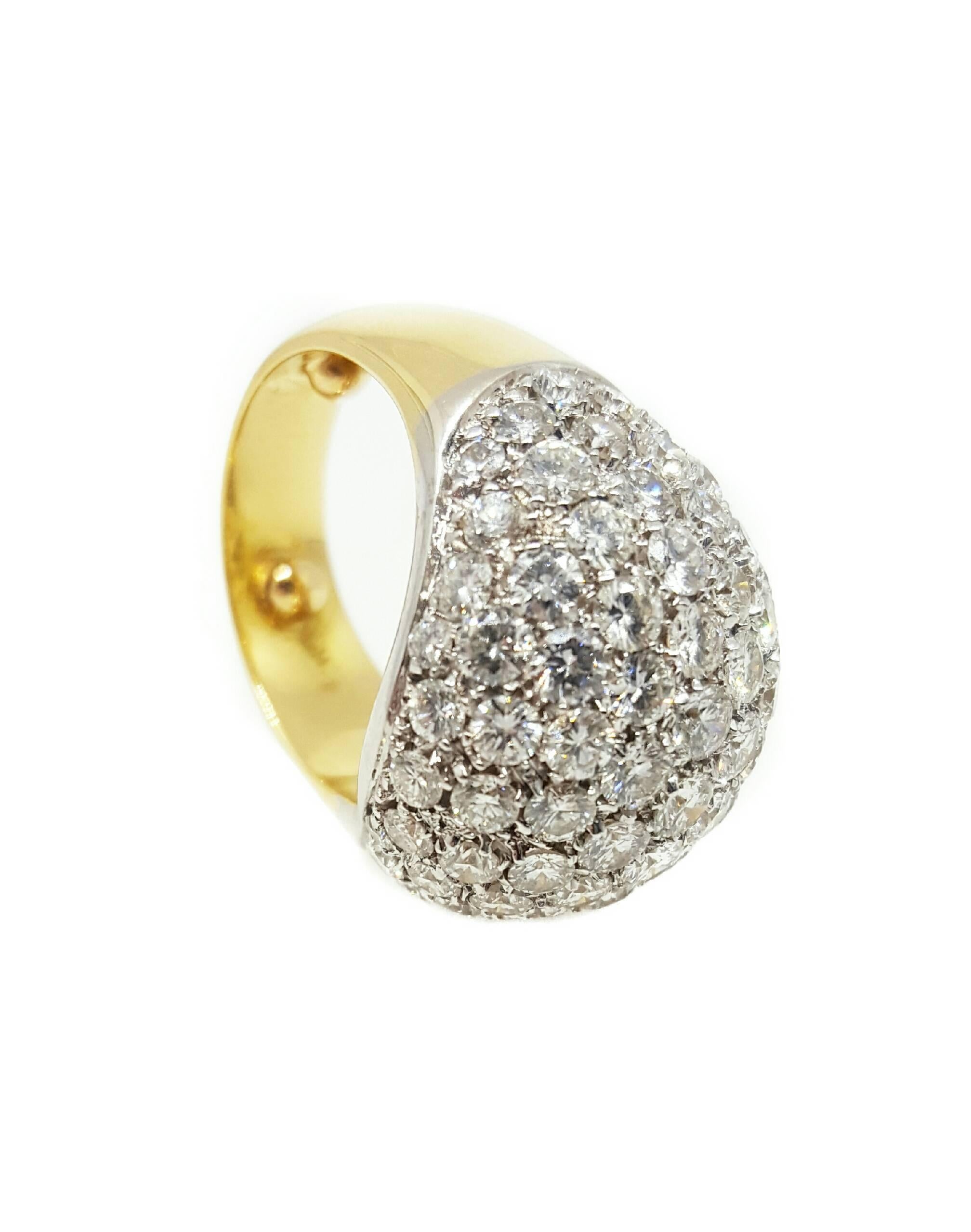 A stunning pave set ring set with 83 Round brilliant cut diamonds. The diamonds, totaling approximately 5.00 carats total weight, are G to H color and VS2 clarity. The ring was beautifully made from both 18 karat white and yellow gold. The head,