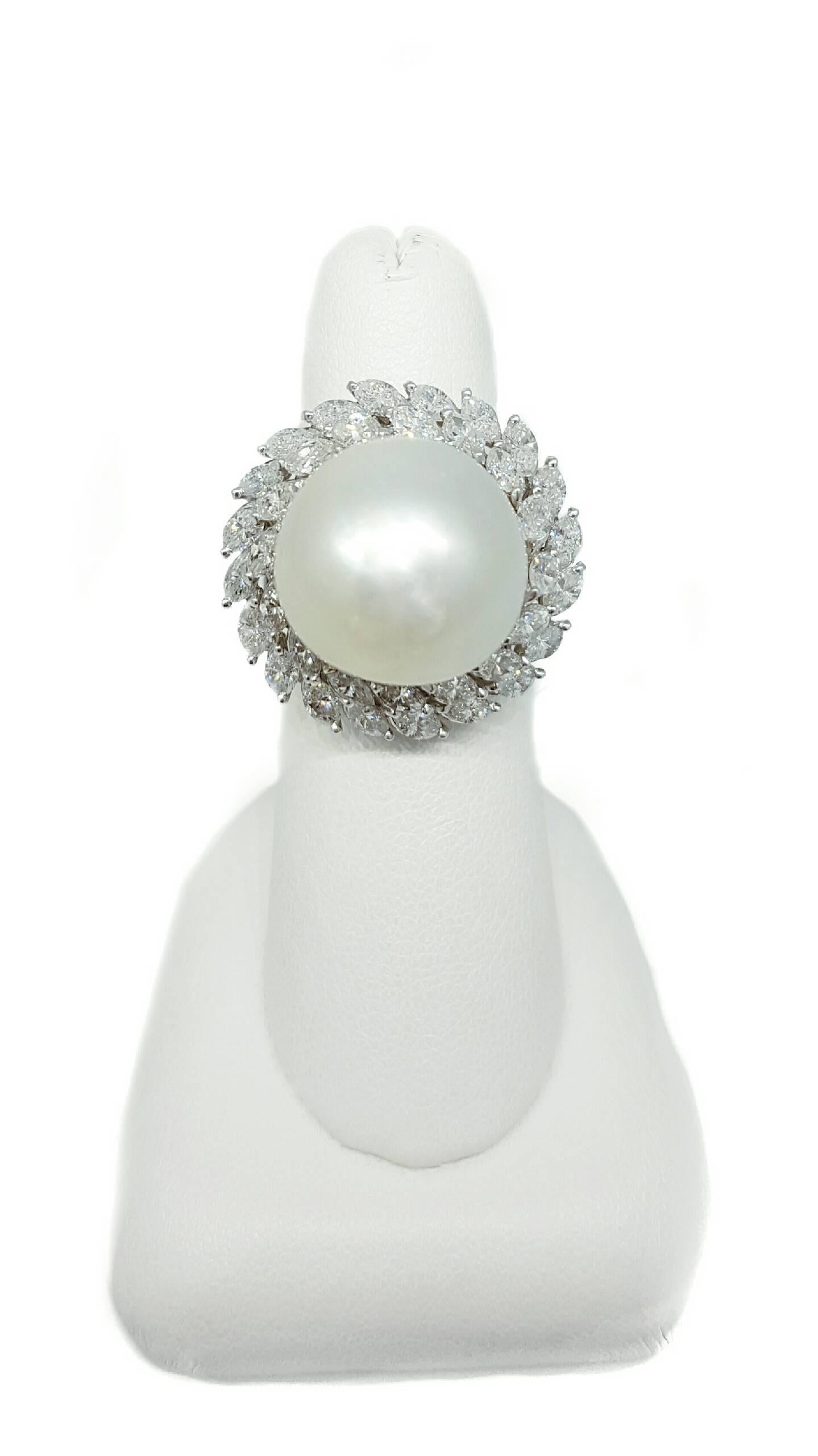 A platinum ring set with a stunning 16.5mm South Sea Pearl and 36 marquise cut diamonds. The diamonds have a total approximate weight of 4.32 carats and are H color, VS2 to SI1 clarity. The ring is a split shank design made in platinum and weighs