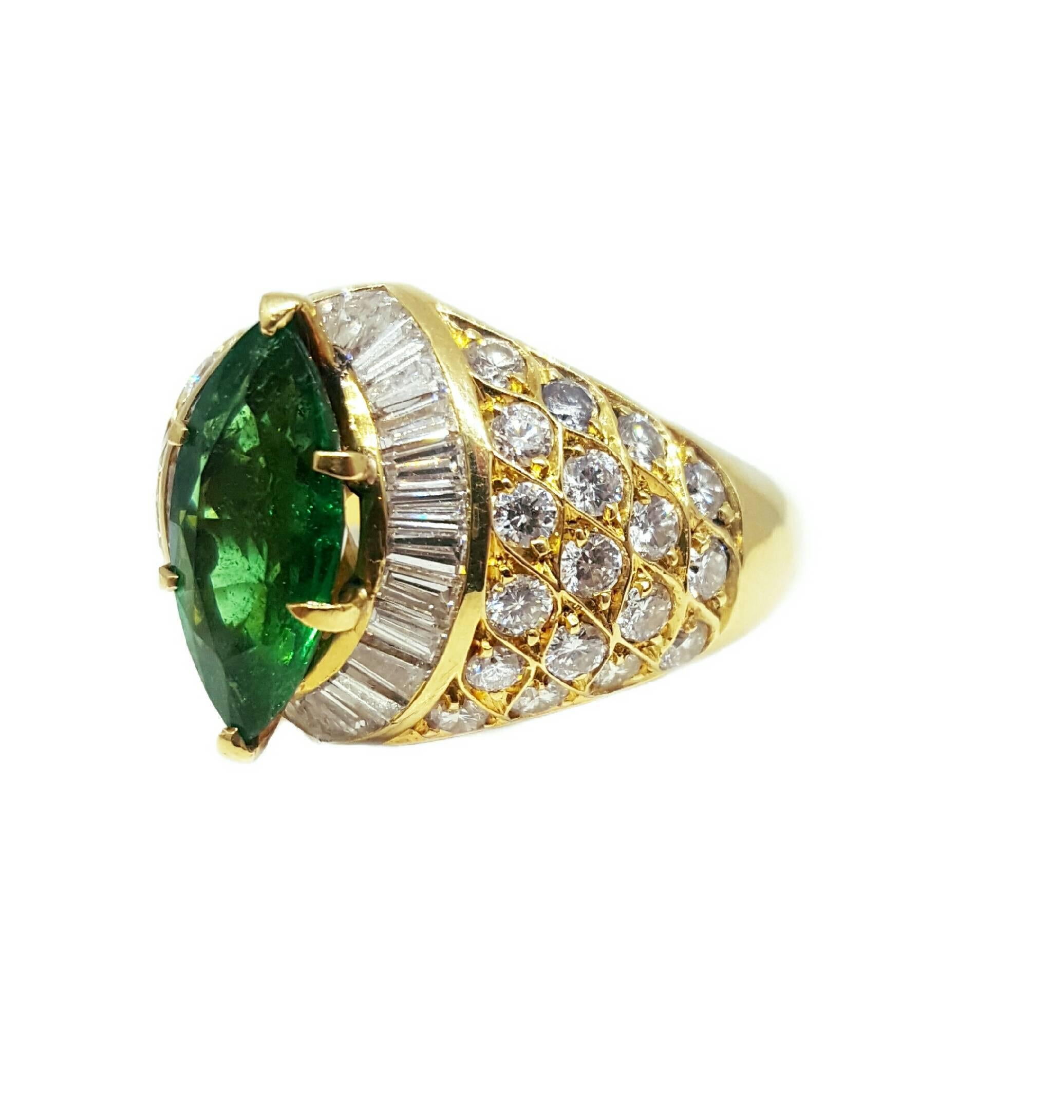 A one of a kind marquise cut emerald set into an 18 karat yellow gold mounting surrounded by 2.00 carats of diamonds. The emerald is a fine medium dark green color and weighs approximately 2.00 carats. Made by an unknown designer, the best part