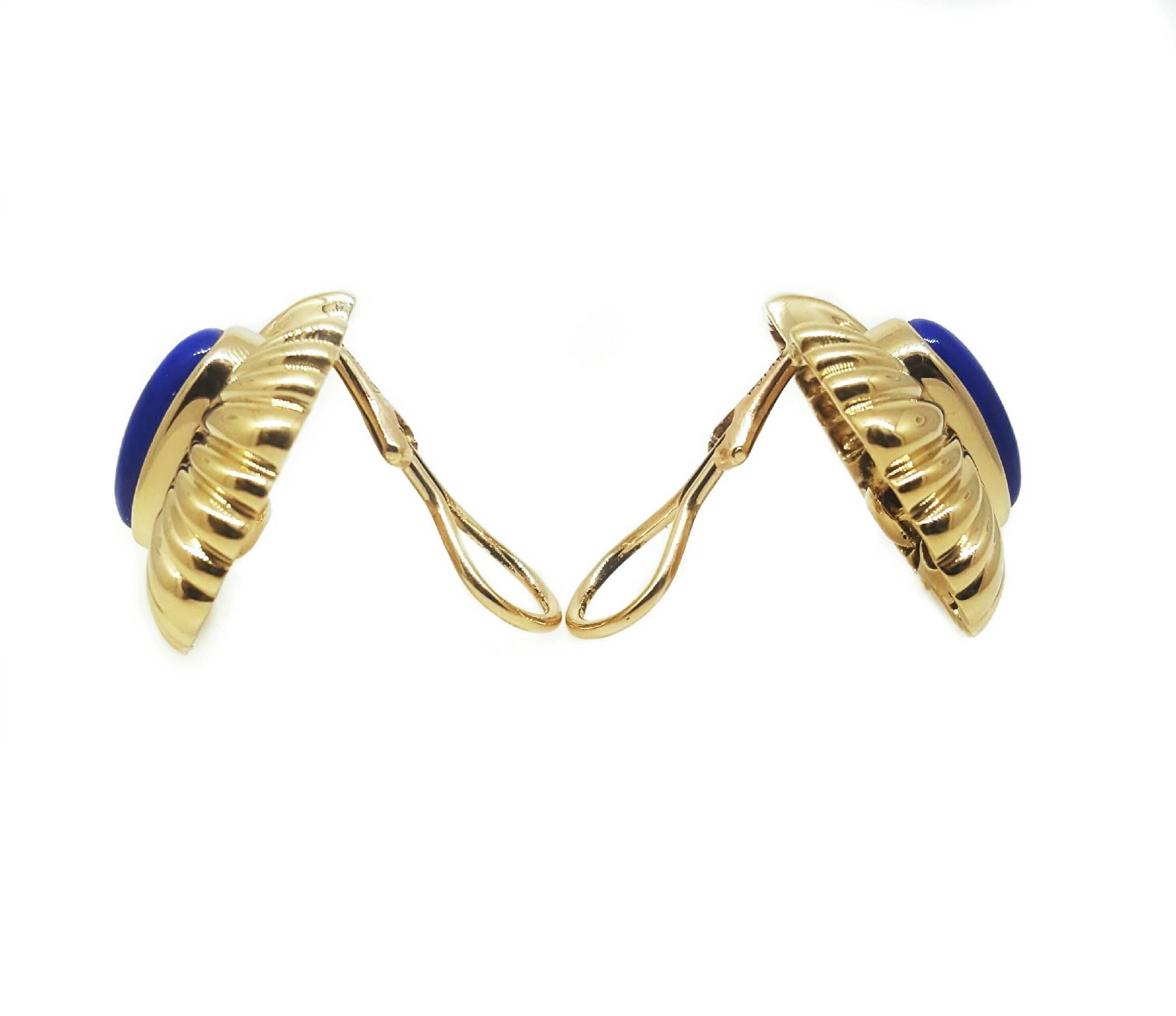 A nice pair of clip on style earrings. The earrings measure 0.8 inches long and 1 inch wide. The earrings feature two beautiful carved Lapis Lazuli stones. 