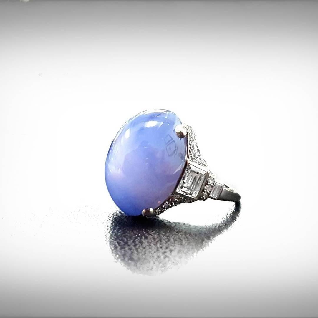 This Art Deco ring is set with 1 oval cabochon cut natural blue star sapphire measuring 18.89 x 15.10 x 12.89mm (depth est.) weighing approximately 39.71ct. This stone has a complete six ray star with very good movement. 

The mounting made in