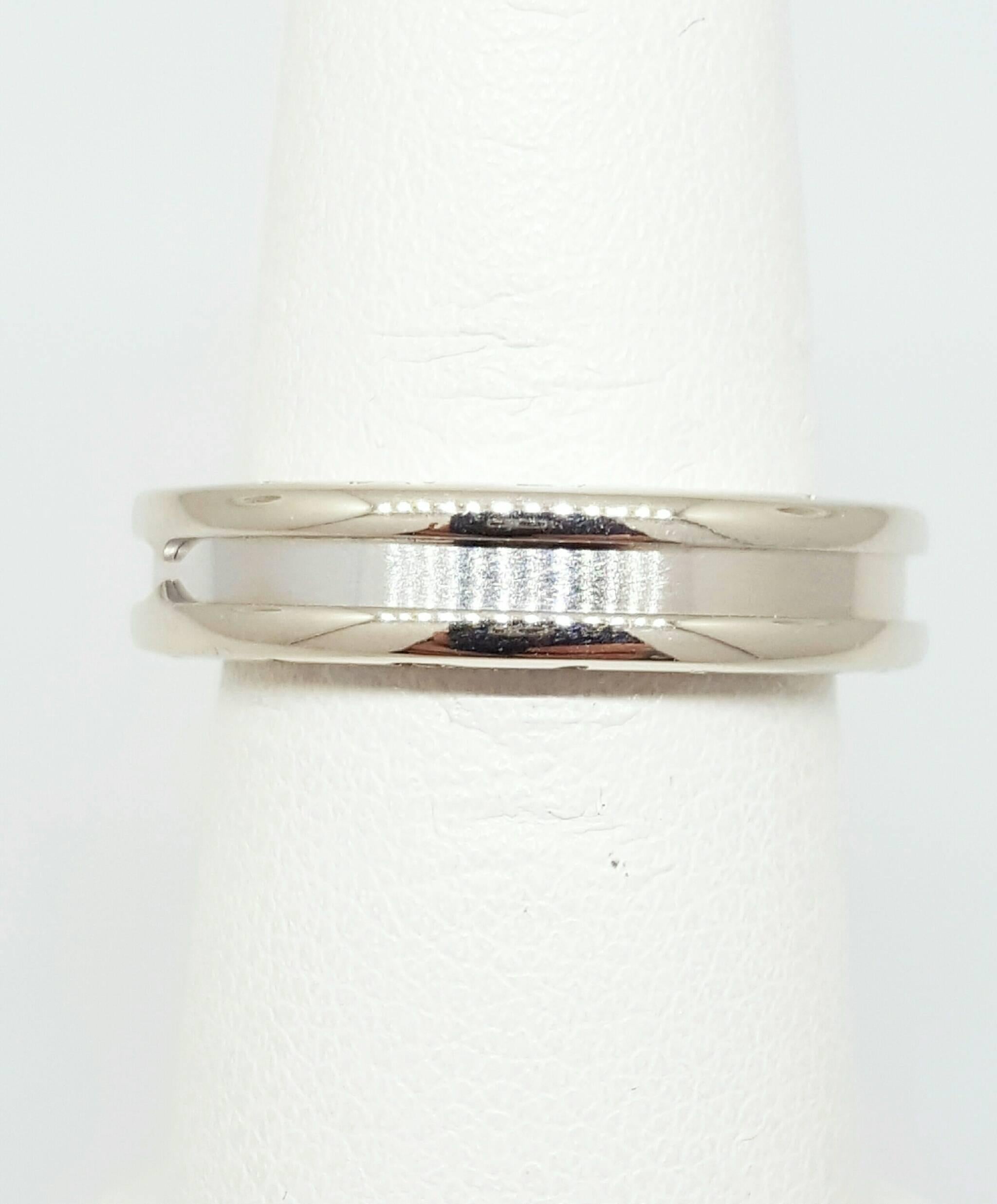An 18 karat white gold Bvlgari B.Zero1 ring. The ring is 5.0mm in diameter and is a size 6.5. The ring is embossed with Bvlgari on both sides and is stamped "Bvlgari 750" on the inside with authentic Bvlgari serial numbers. 