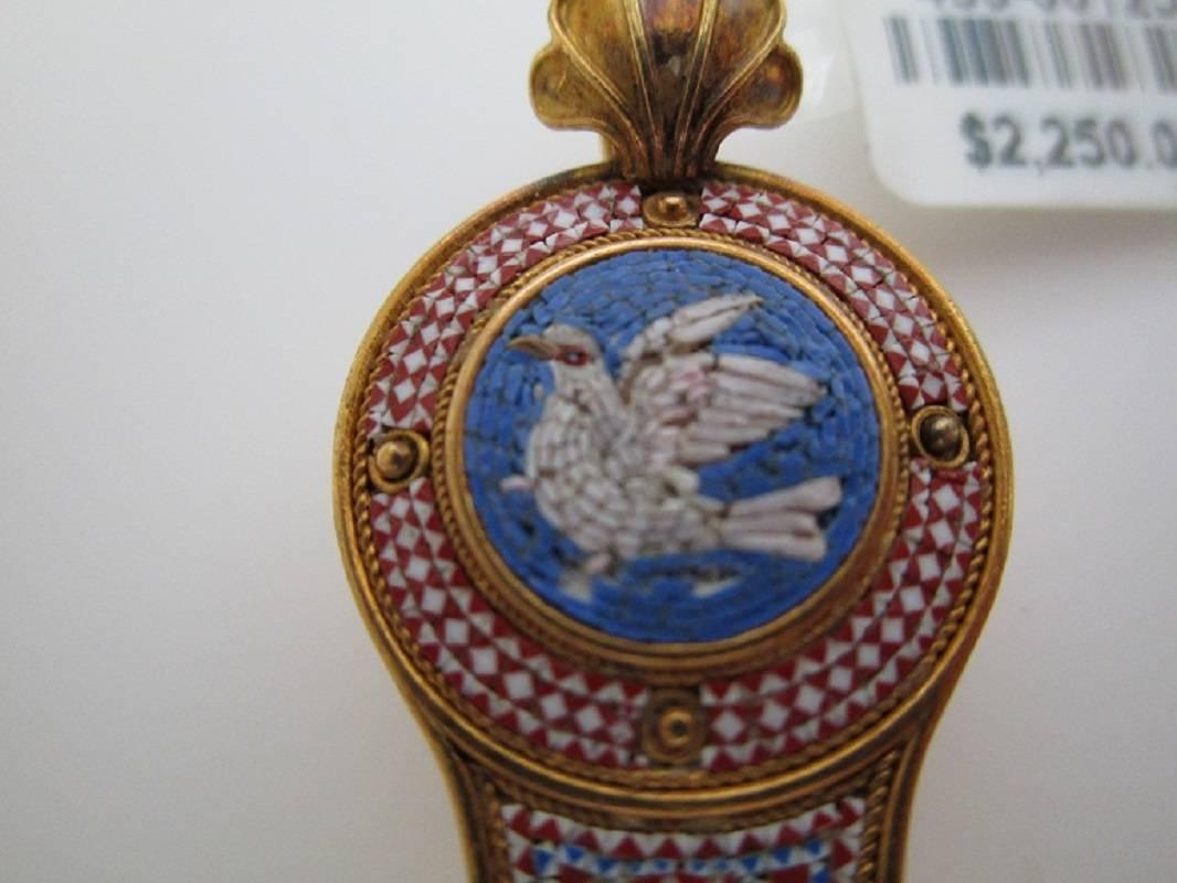 Micro Mosaic Pendant 18K Yellow Gold c 1860 Victorian
Dove of Peace with Small Memorial Photo Locket on the back
Made in Italy, possibly in the Vatican shops
C 1860

St. John & Myers Jewelry is the only jeweler in Central Kentucky with