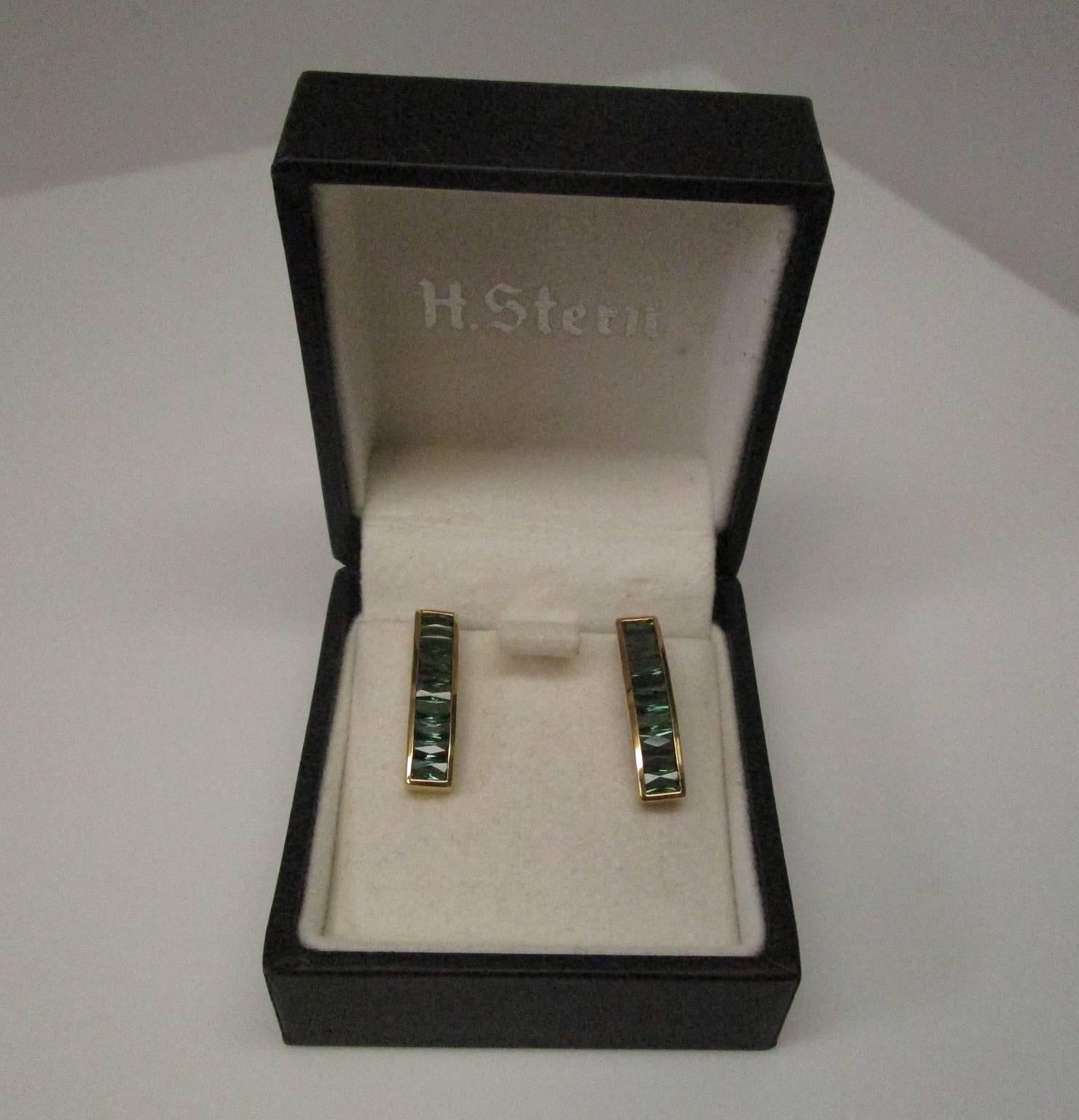 These are a stunning pair of 18 K yellow gold earrings featuring tourmaline baguettes. They were made by H. Stern and are in the original box. The simple design makes them perfect for the office and the shine takes them into the night. Very