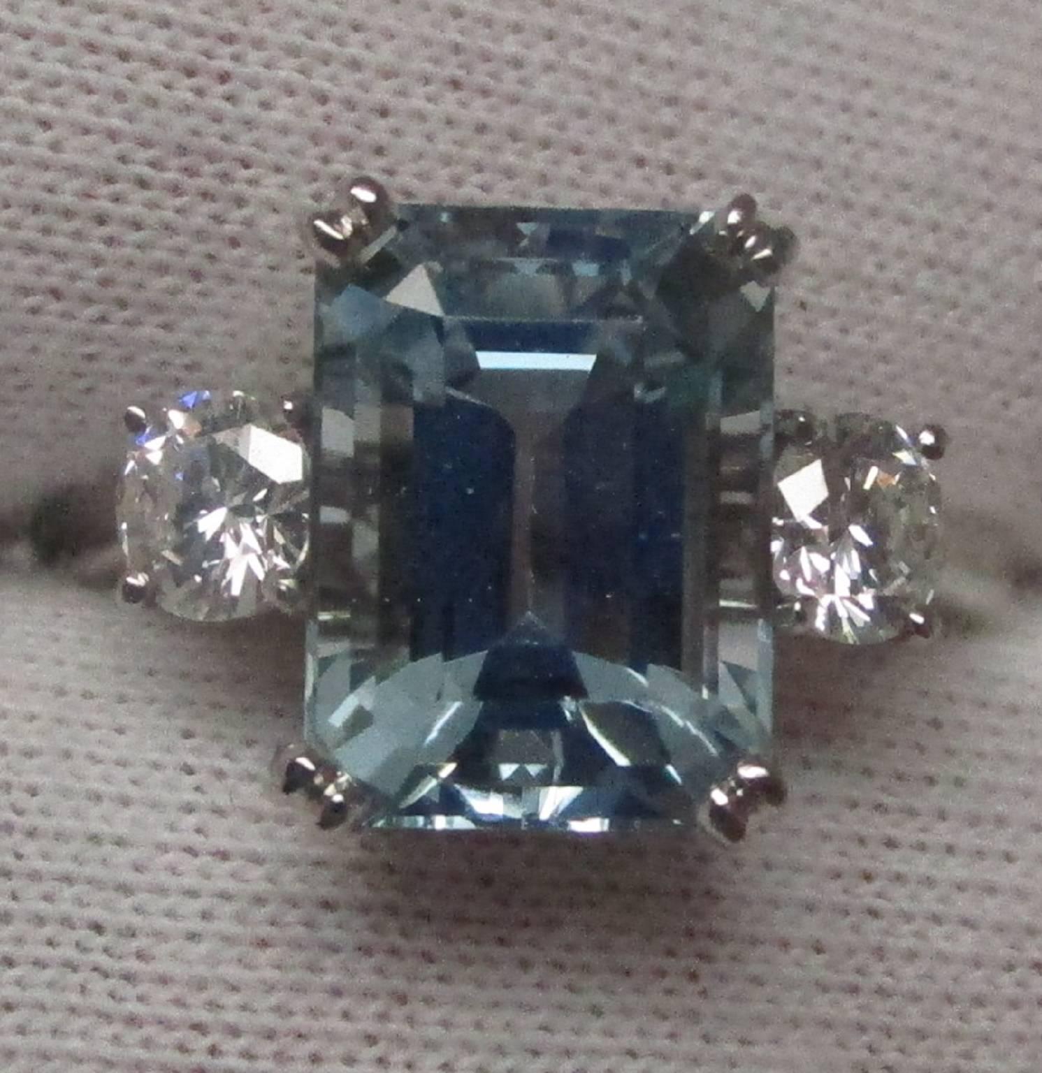 This aquamarine ring is a subtle stone-blue color that radiates poise and refinement. This ring is glacial and cool, which is enhanced by the platinum setting. The aquamarine is 4.23 carats, and it is big and bold, but not overbearing. There are two