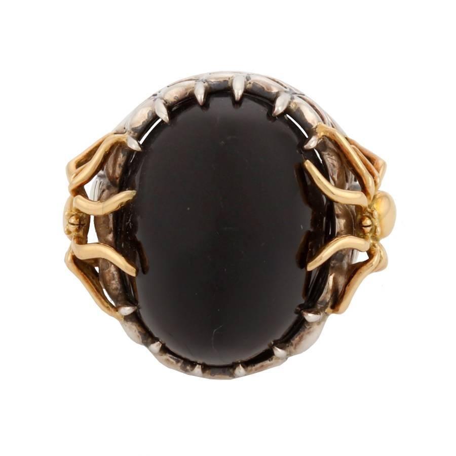 Spider ring with oval cabochon black jade and small spider in 18k gold. Spider web pattern in sterling silver. This piece was made in Manhattan entirely by hand, and was cast, one at a time, using the lost wax process. Prince John Landrum Bryant