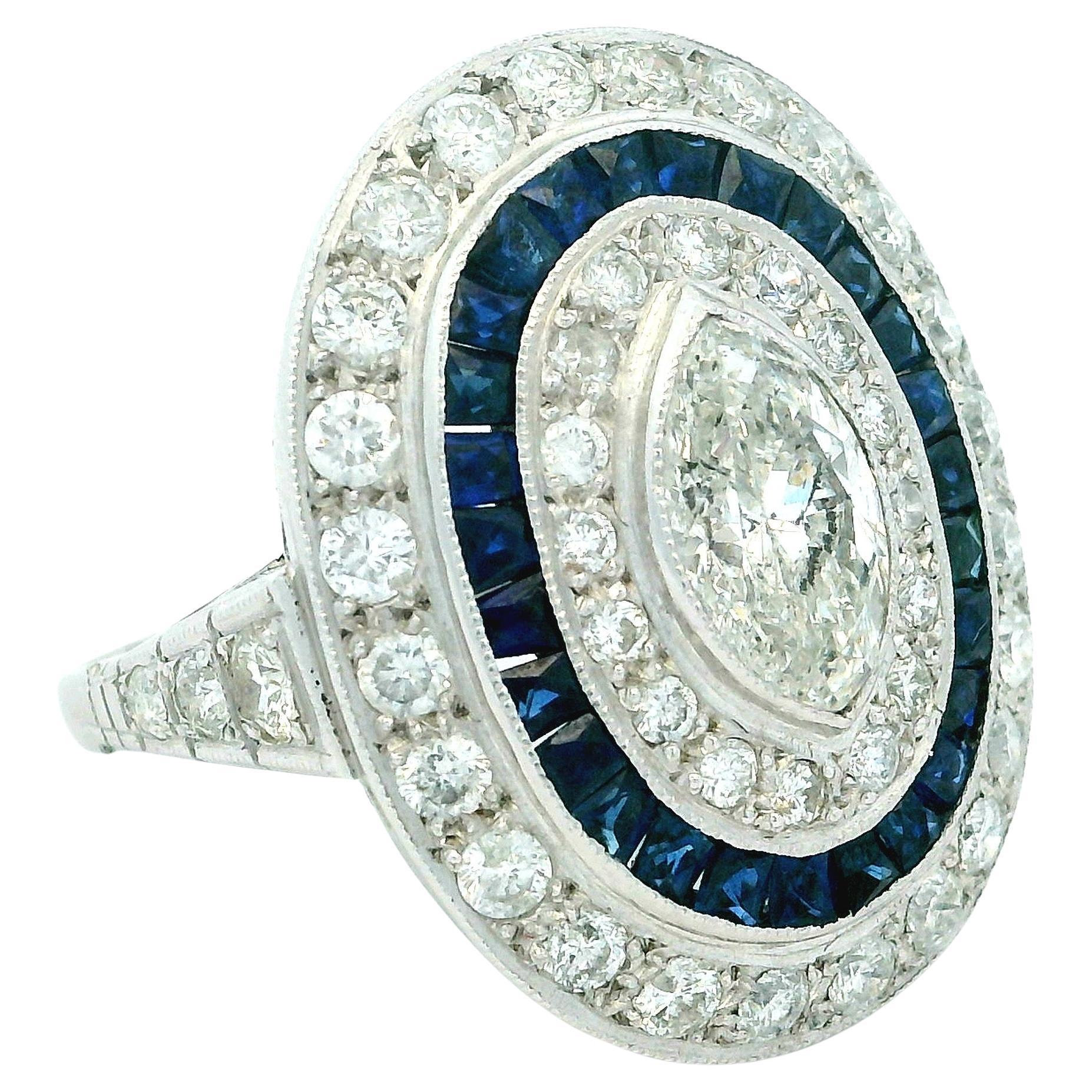Art Deco  Platinum Ring with Marquise Diamond & Sapphire Halo, circa 1920s For Sale