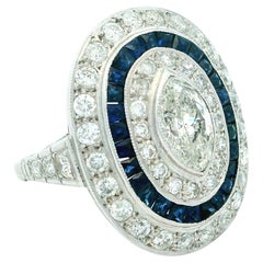 Art Deco  Platinum Ring with Marquise Diamond & Sapphire Halo, circa 1920s