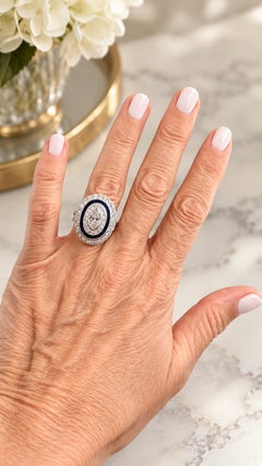 Art Deco  Platinum Ring with Marquise Diamond & Sapphire Halo, circa 1920s