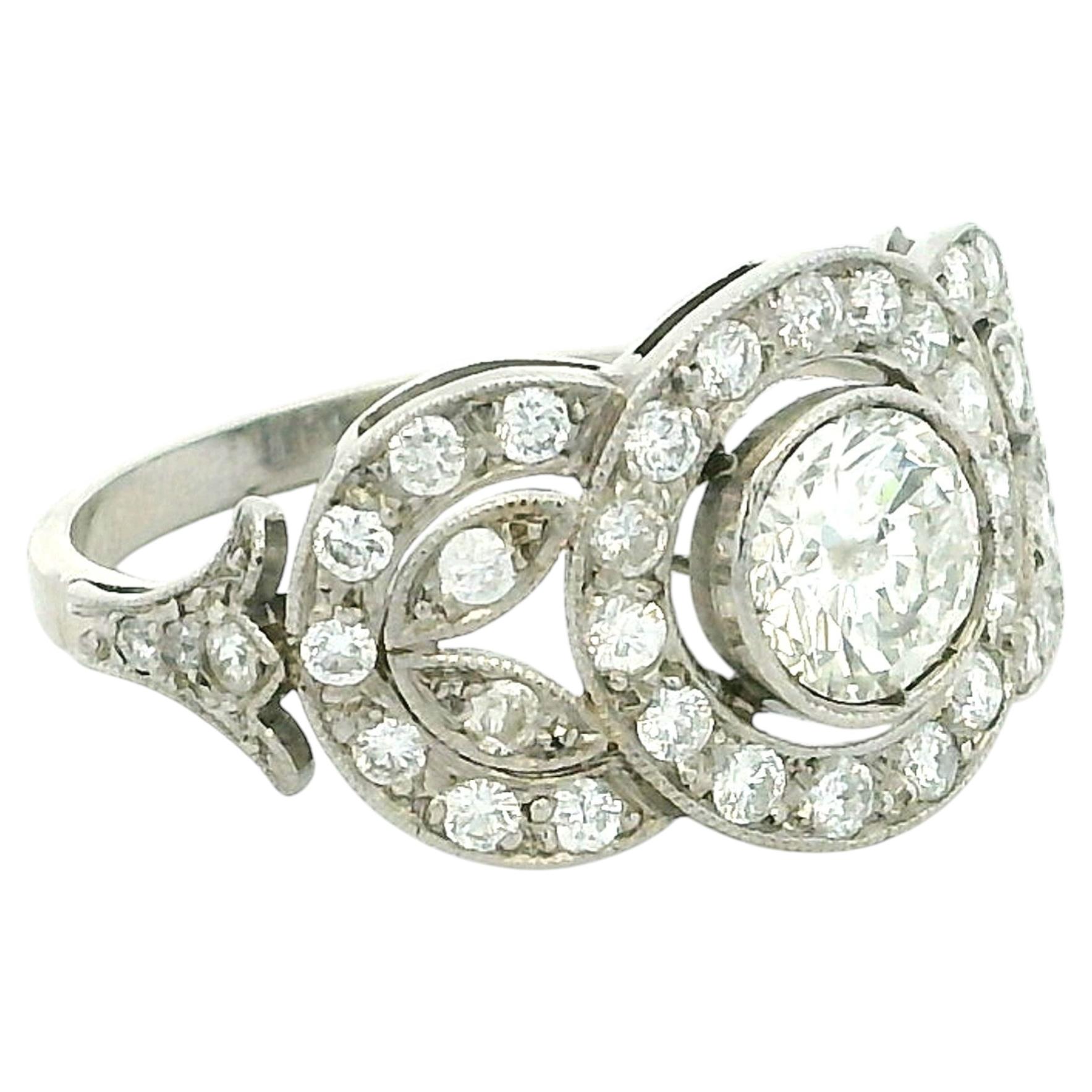 Late Art Deco Platinum Diamond Halo Ring with 0.85 Carat Center Diamond