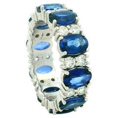 18K White Gold 5.80 Carat Blue Sapphire and 1.17 Carat Diamond Eternity Ring