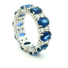 18K White Gold 5.80 Carat Blue Sapphire and 1.17 Carat Diamond Eternity Ring