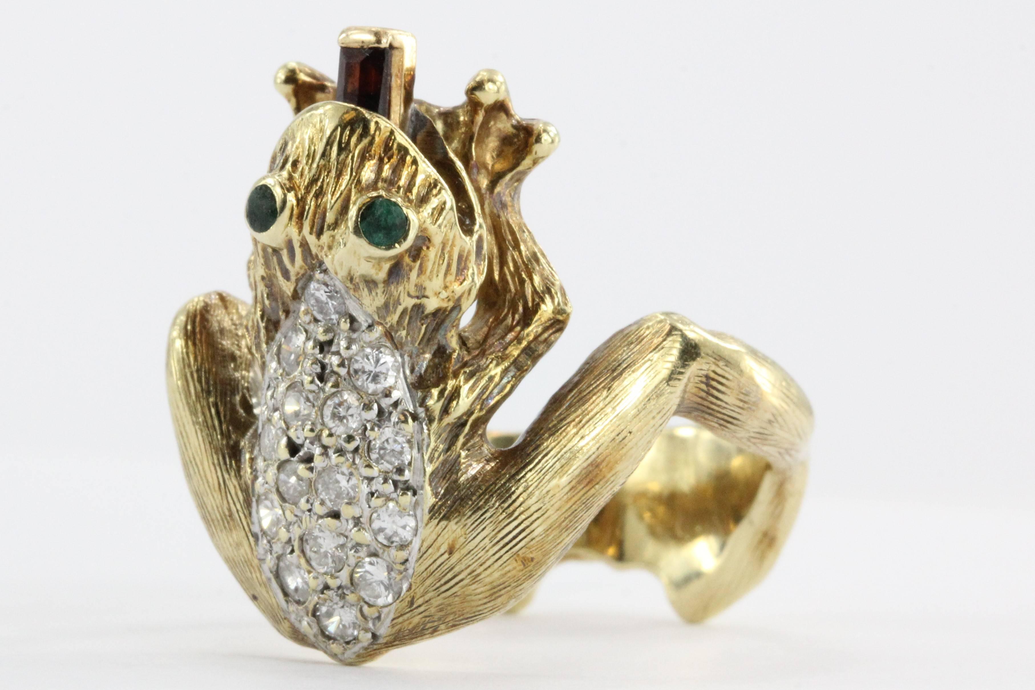 Vintage 14K Gold Diamond & Garnet Whimsical Frog Ring with Garnet Tongue & Eyes. 

The piece was custom made some time ago. It is hallmarked 14K. The ring is set with .40 carats of F color, VS1/Vs2 clarity diamonds, The eyes are green tsavorite