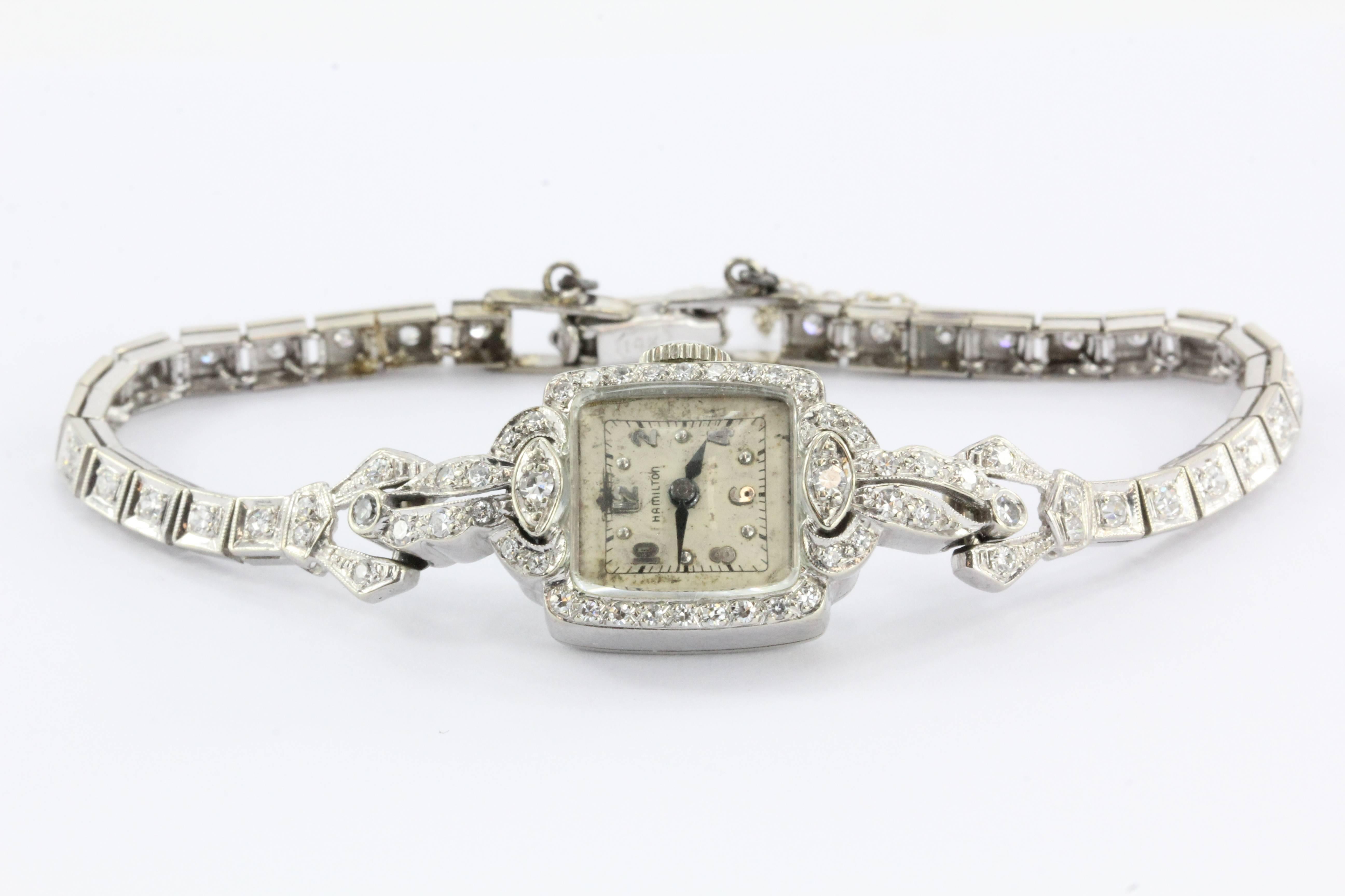 Antique 14K White Gold & Diamond 17 Jewel Hamilton Luxury Watch. The watch case and band are in excellent estate condition but the actual watch is not running. The dial will also need to be replaced. The entire piece is set with 76 single cut