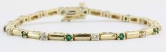 Bracciale tennis con diamanti e smeraldi in oro giallo 14k