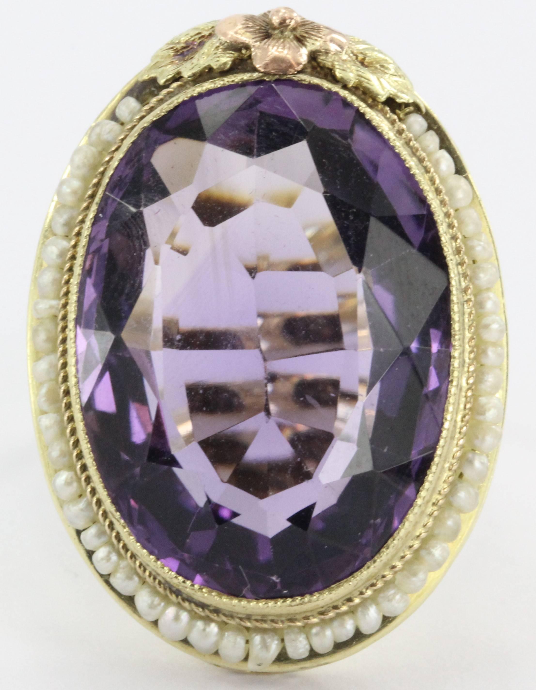 Antique Art Nouveau 14K Gold 16 Carat Amethyst & Seed Pearl Ring. The ring is in excellent estate condition and ready to wear. The amethyst is approximately 16 carats and wreathed by 46 seed pearls. The ring is mostly 14K yellow gold but features