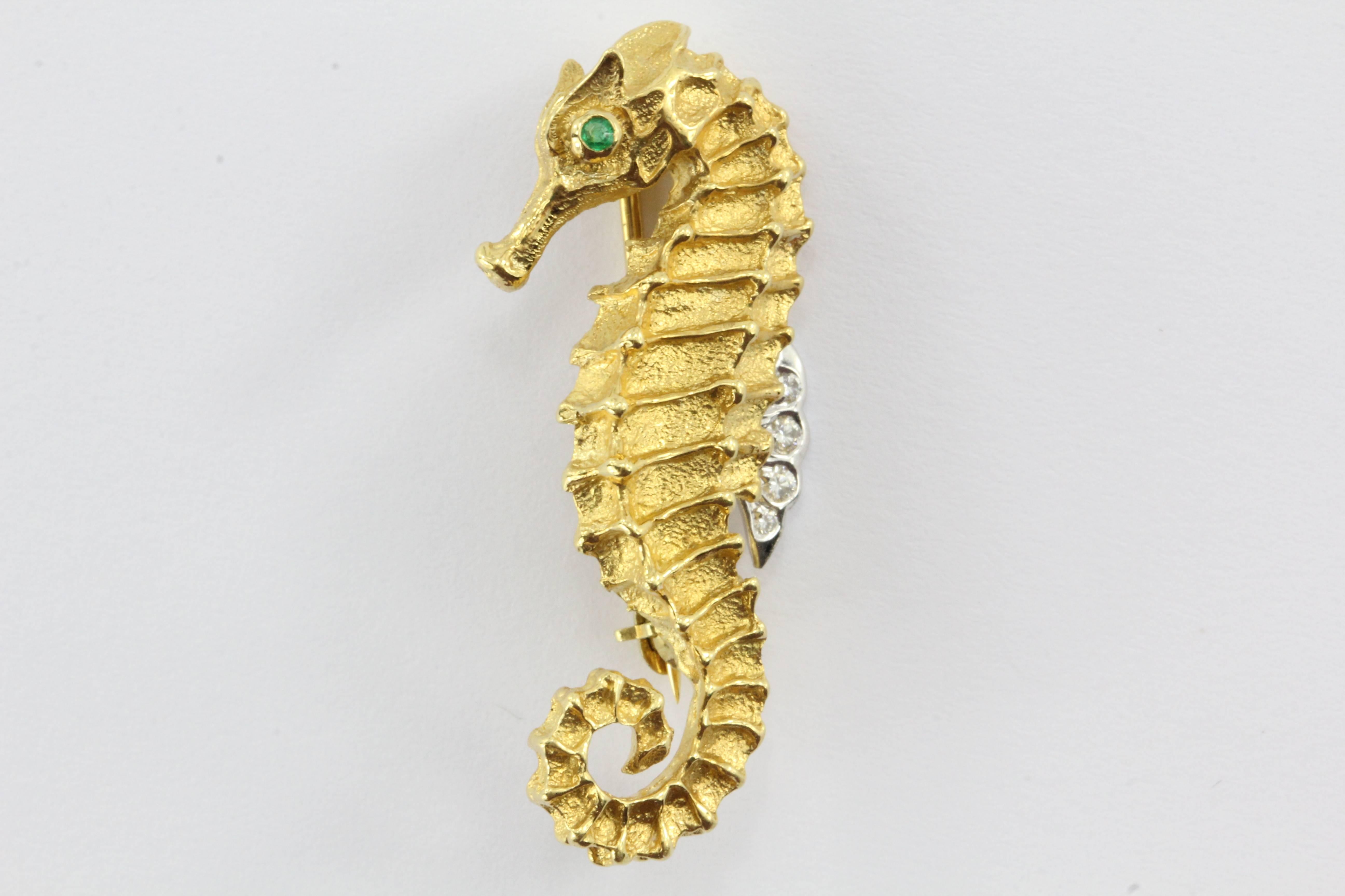 Rare Vintage Tiffany & Co 18k Gold Diamond Emerald Seahorse Pin Brooch.
Circa 1996 18k yellow and white gold diamond seahorse pin brooch with emerald eyes.
The diamonds are appoximately .04 tcw and emerald is .01 tcw.
The Brooch is approximately