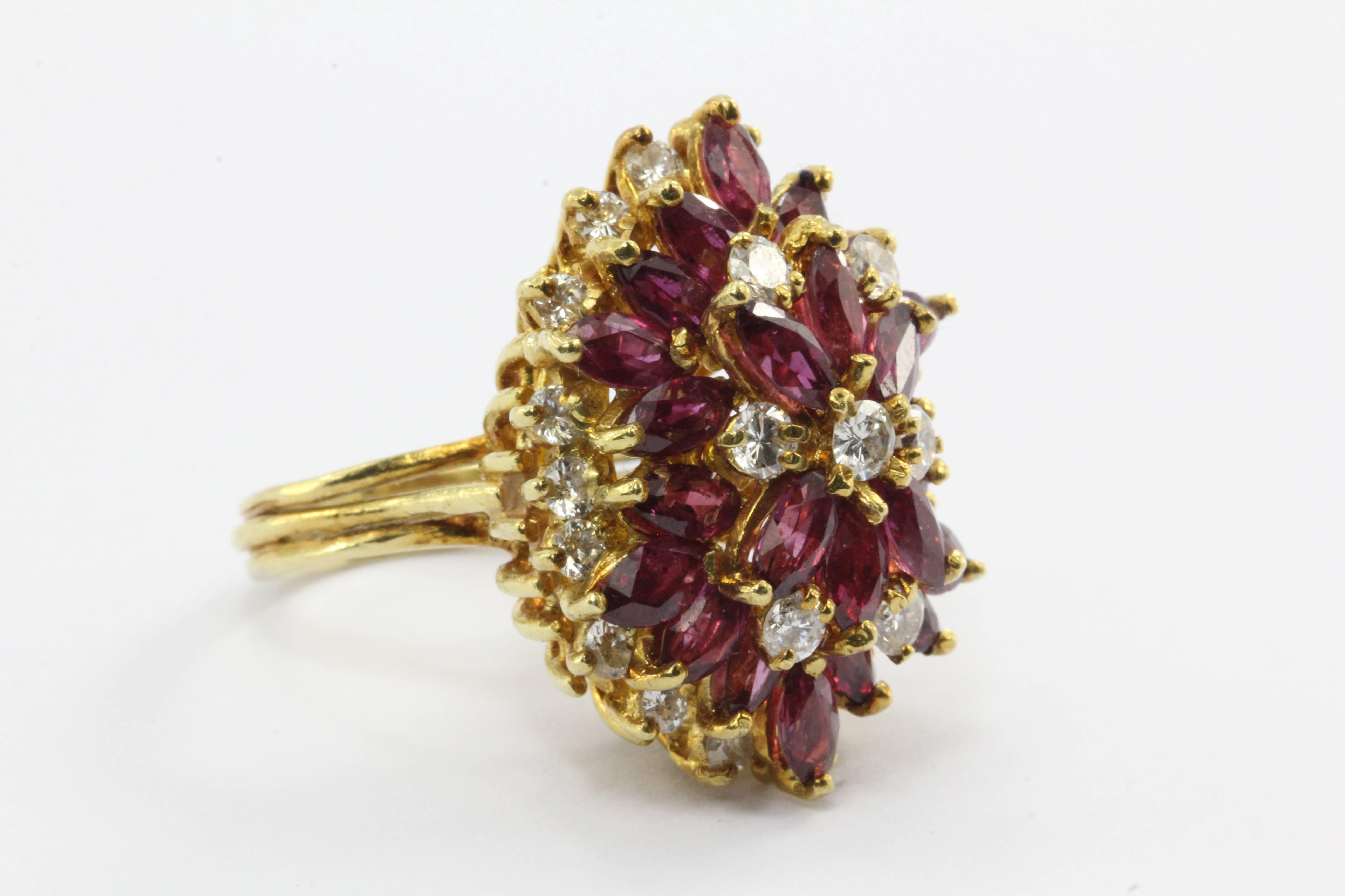 An exquisite ruby and diamond cocktail ring.

The rubies are all natural wonderfully cut marquise shape and equal a total of 5 carats

The diamonds are round brilliant G/H color and Si1 clarity.  There is approximately 1 carat of diamonds.

In