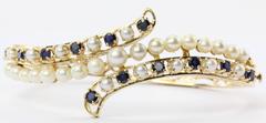 Victorian Revival Style Circa 1950's 14K Gold Pearl Sapphire Bangle Bracelet