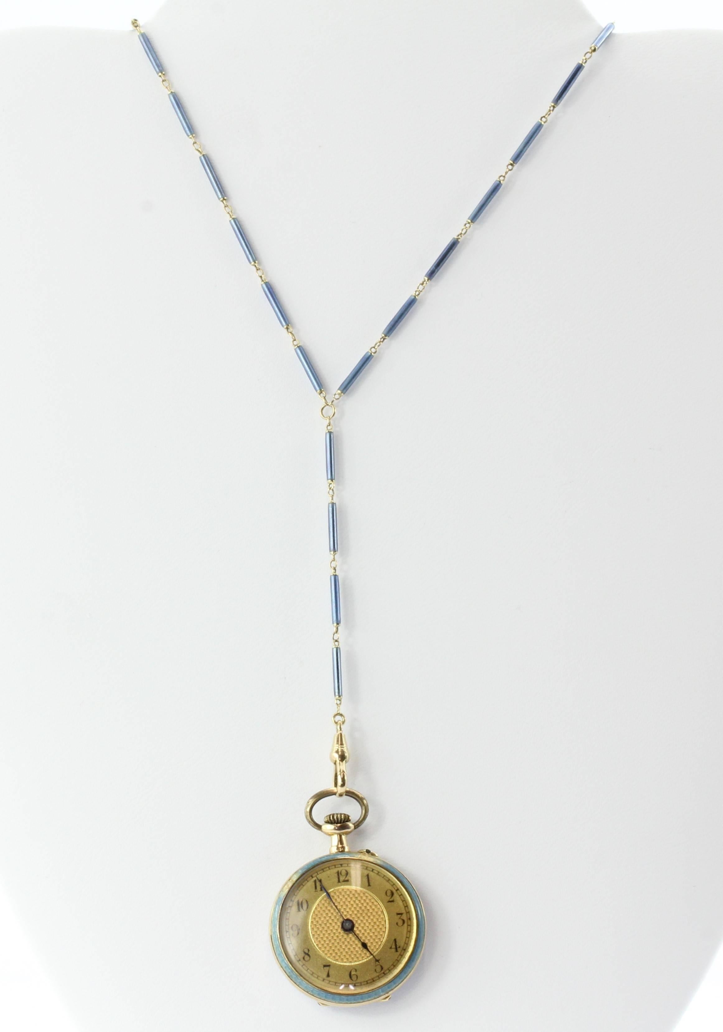 Art Deco 14K Gold Blue Enamel Swiss Pocket Watch & Lorgnette Necklace Chain. The watch is in great running condition. There is some damage to the enamel edge of the watch and a couple of the links on the chain. The chain is 14K yellow gold and