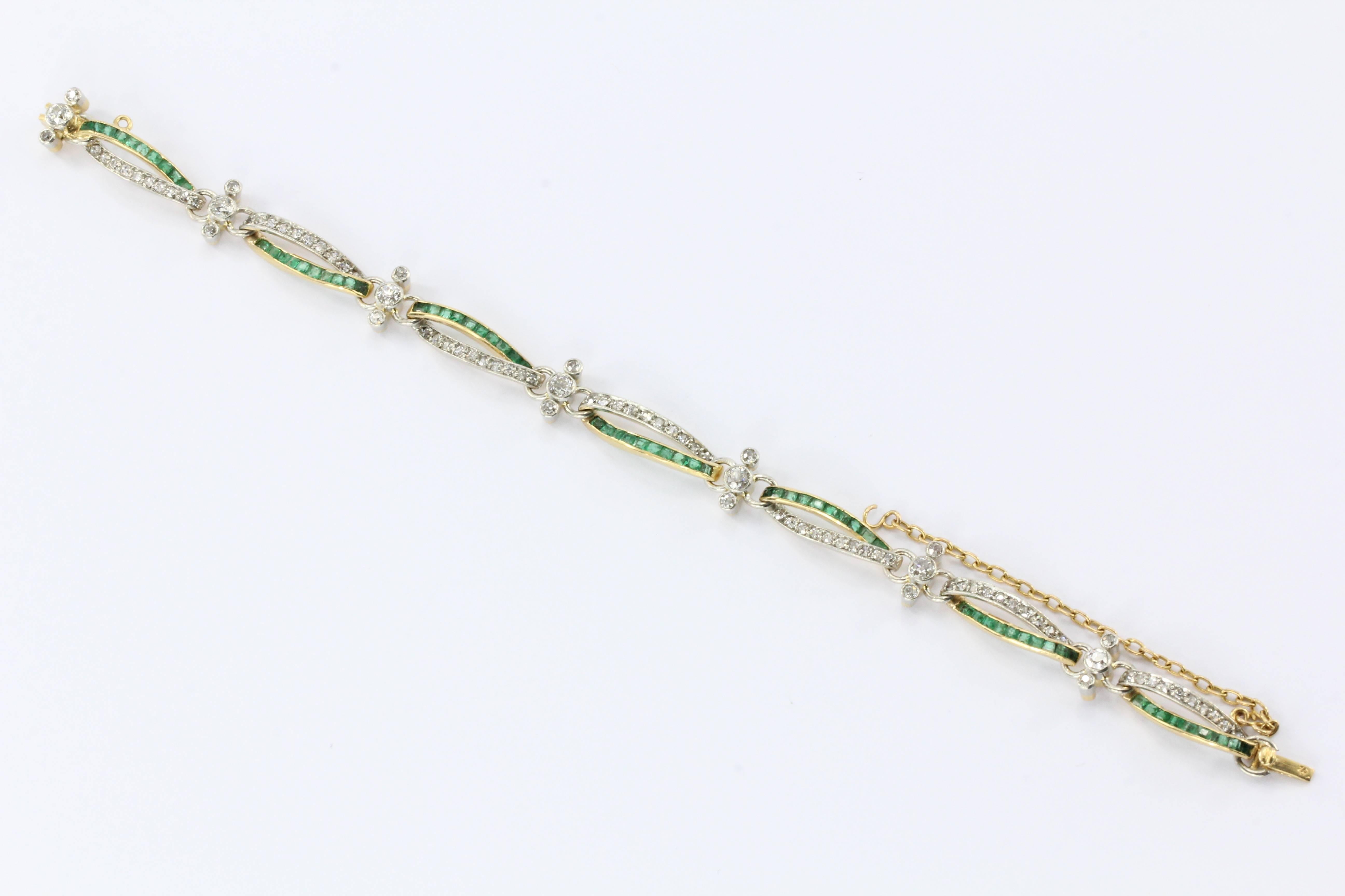 An exquisite Edwardian 18K Yellow Gold with Platinum Top Diamond and Emerald Tennis Bracelet. 

2.5 Carats Total.

Hallmark: 18K

Composition: 18K Yellow Gold/Diamond/ Natural Emerald/Platinum Top

Primary Stone: Diamond (91)

Color: H-J

Clarity: