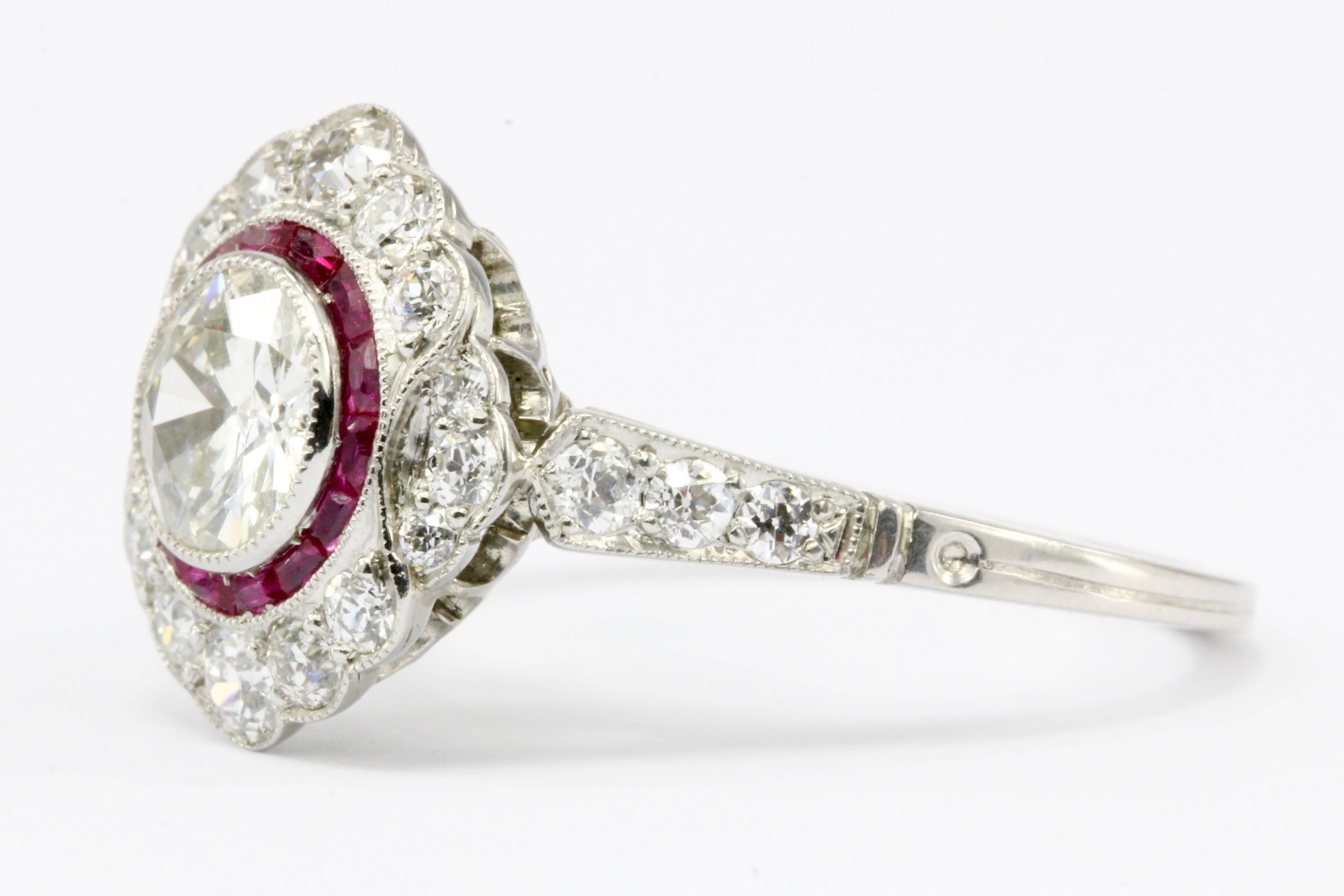 Main Stone: Diamond

Composition: Platinum

Cut: Old European Cut 

Carat: .63

Color: H/I

Clarity: Vs1/2

Accent Stone: Natural Ruby

Carat: .20 CTW

Color: Red

Accent Stone: Diamond

Cut: Old European

Color: G/H

Clarity: VS1-VS2

Ring Size: