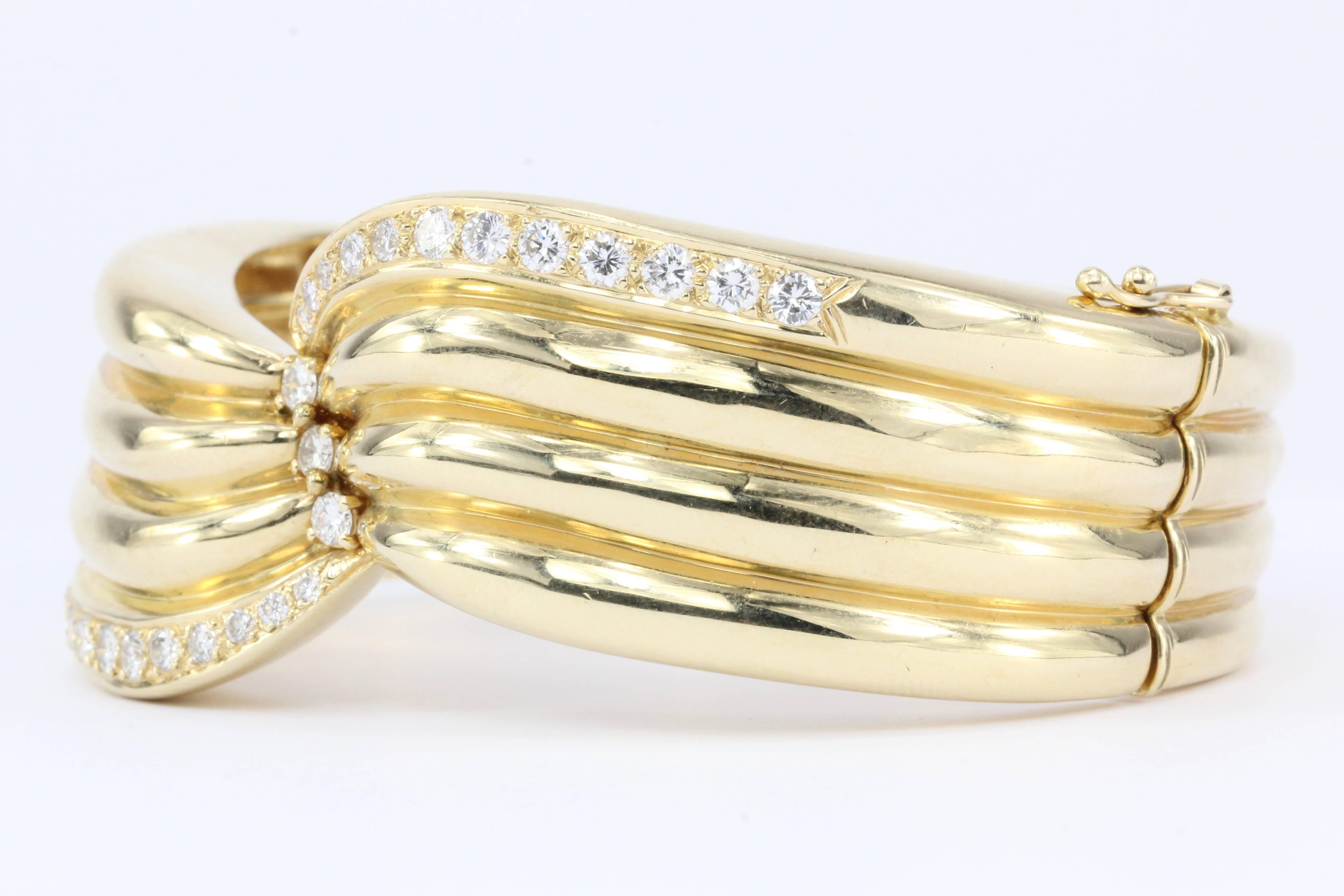 Era: Retro 

Composition: 14K Yellow Gold

Primary Stone: Diamond

Color: F/G

Clarity: Vs1/2

Bracelet Measurements: 8" Outer Circumference 7" Inner Circumference/ 1" wide

Bracelet Weight: 59.8 grams

Condition: Excellent estate