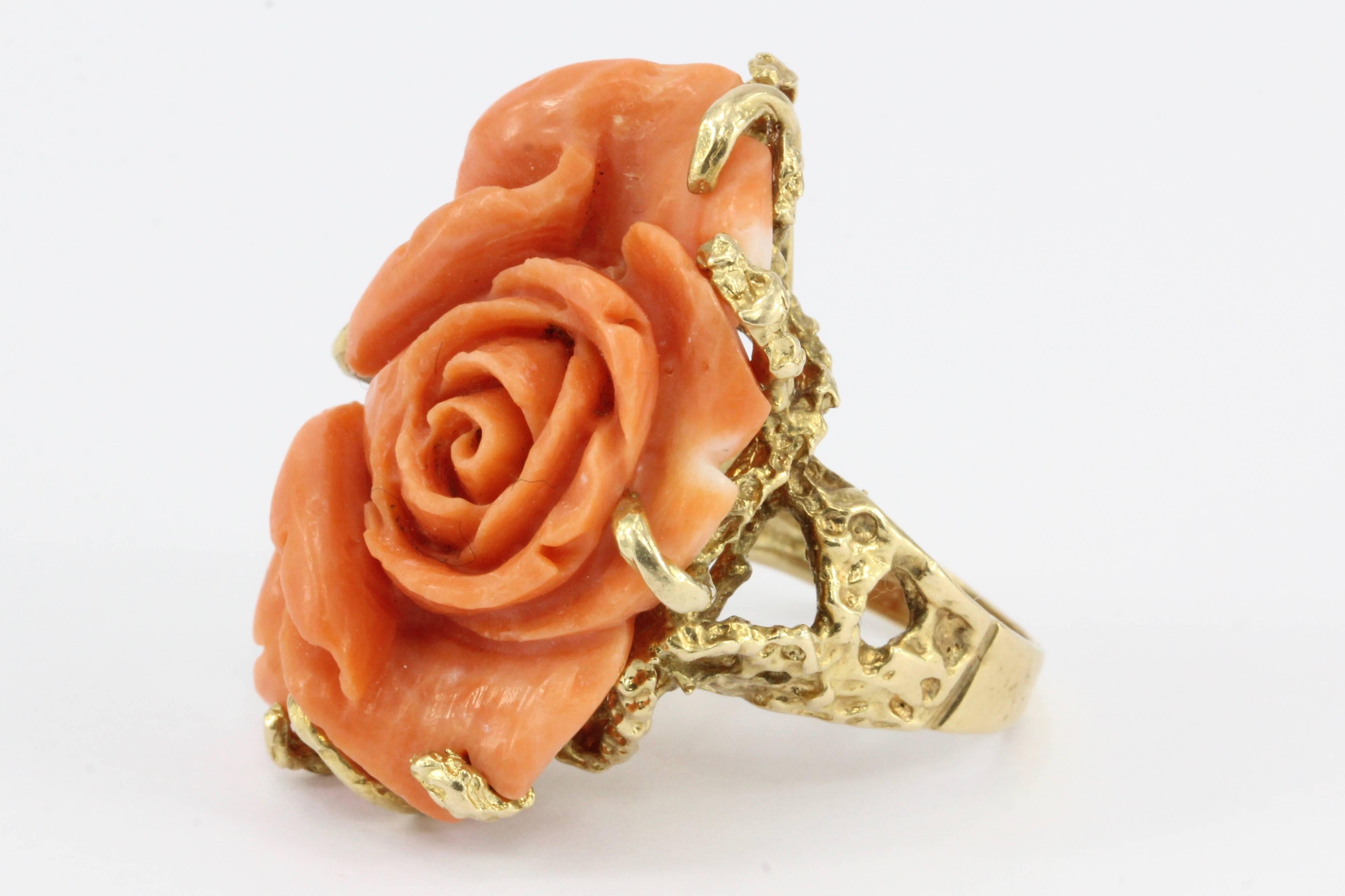 Era: Retro c. 1970s

Composition: 14K yellow gold

Primary Stone: Coral

Ring Face: 24mm wide x 36mm high

Rise Above Finger: 16 mm

Ring Size: 7

Ring Weight: 15.1 grams

Ring Condition: Excellent estate condition, ready to wear